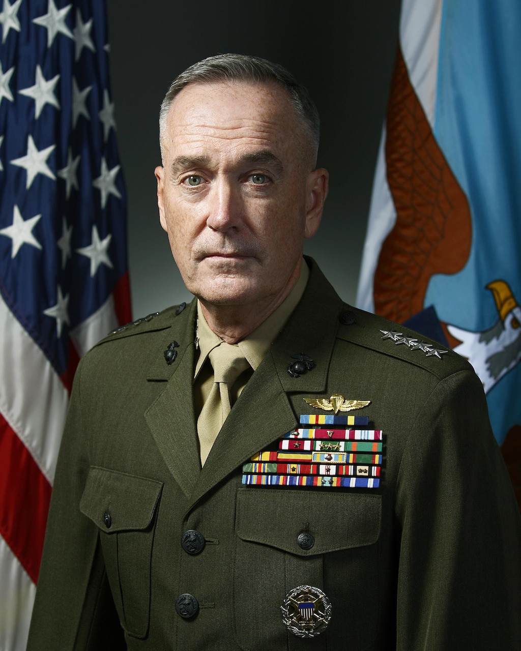 Marine Corps Gen. Joseph F. Dunford Jr. poses for an official portrait against a background with flags.