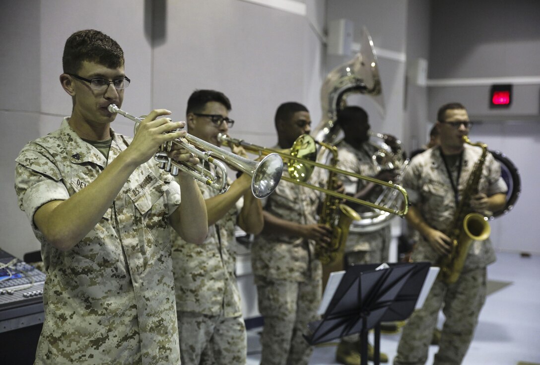 Marines with the 2nd Marine Division Band rehearse for Amber N. Carter, a resident of Hubert, N.C., during her visit to the band’s command post at Camp Lejeune, N.C., Sept. 29, 2015. Amber always dreamed of joining the Marine Corps, but could not due to William’s syndrome. Staff Sgt. Isaiah Riley, a mess chief with 10th Marine Regiment, brought her and her family aboard the base to watch the band play. (U.S. Marine Corps photo by Cpl. Paul S. Martinez/Released)