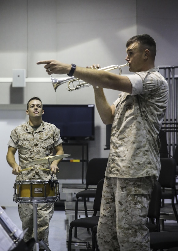 Sgt. Michael R. Hickey, right, a trumpeter with the 2nd Marine Division Band, leads the band in rehearsal for Amber N. Carter, a resident of Hubert, N.C., during her visit to the band’s command post at Camp Lejeune, N.C., Sept. 29, 2015. Amber always dreamed of joining the Marine Corps, but could not due to William’s syndrome. Staff Sgt. Isaiah Riley, a mess chief with 10th Marine Regiment, brought her and her family aboard the base to watch the band play. (U.S. Marine Corps photo by Cpl. Paul S. Martinez/Released)
