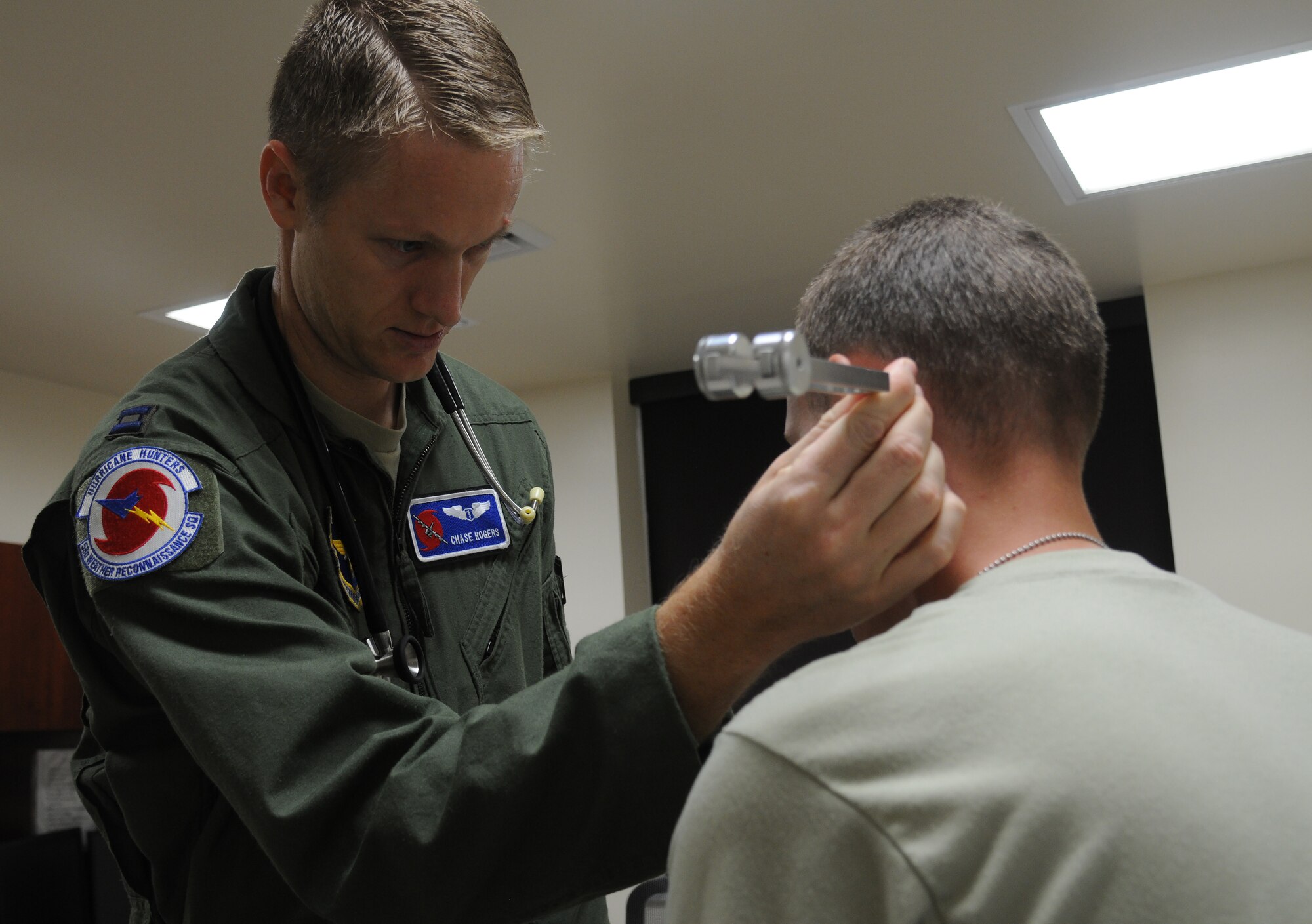 Capt. Chase Rogers, 81st Aerospace Medicine Squadron flight surgeon, performs a hearing test on Airman Basic Stefan Myers, 334th Training Squadron student, at the student health clinic, Sept. 30, 2015, Keesler Air Force Base, Miss. The student health clinic is placed in the 81st Training Group area so services like physical therapy, mental health, sick hall and regular checkups are readily accessible to technical school students and clinic personnel. (U.S. Air Force photo by Senior Airman Holly Mansfield)
