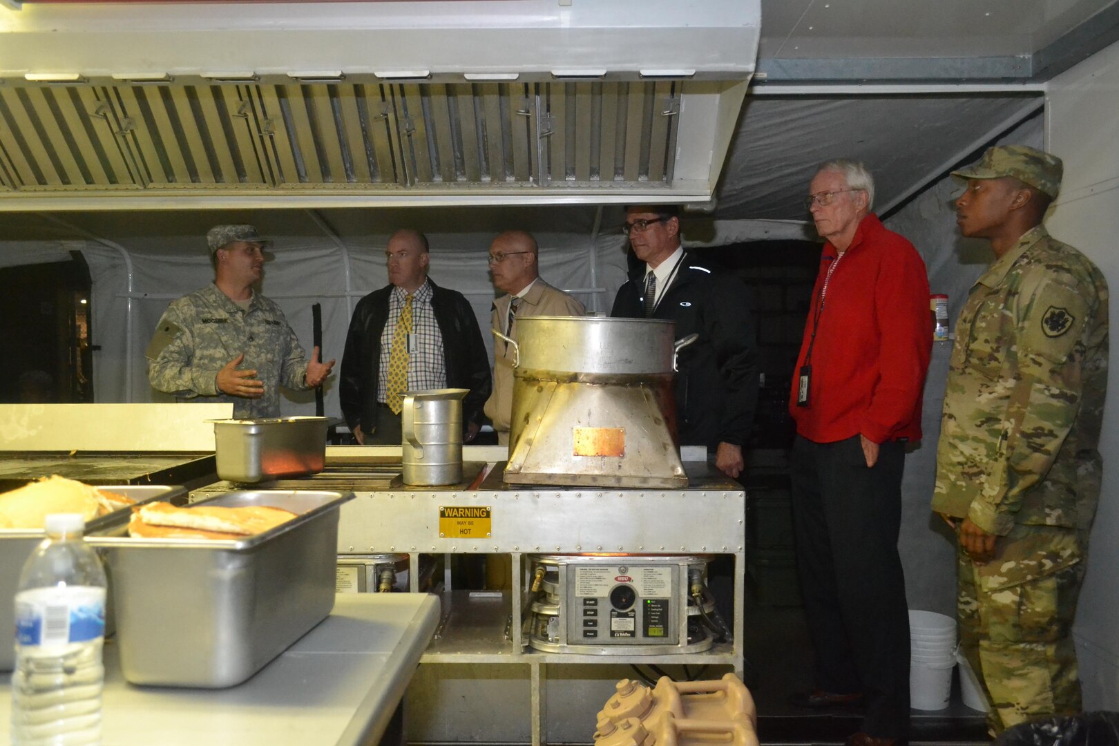 A group of Subsistence employees tour a field kitchen Sept. 24 that was set up by a Pennsylvania National Guard unit staged at NSA Philadelphia in support of the Papal visit and World Meeting of Families.