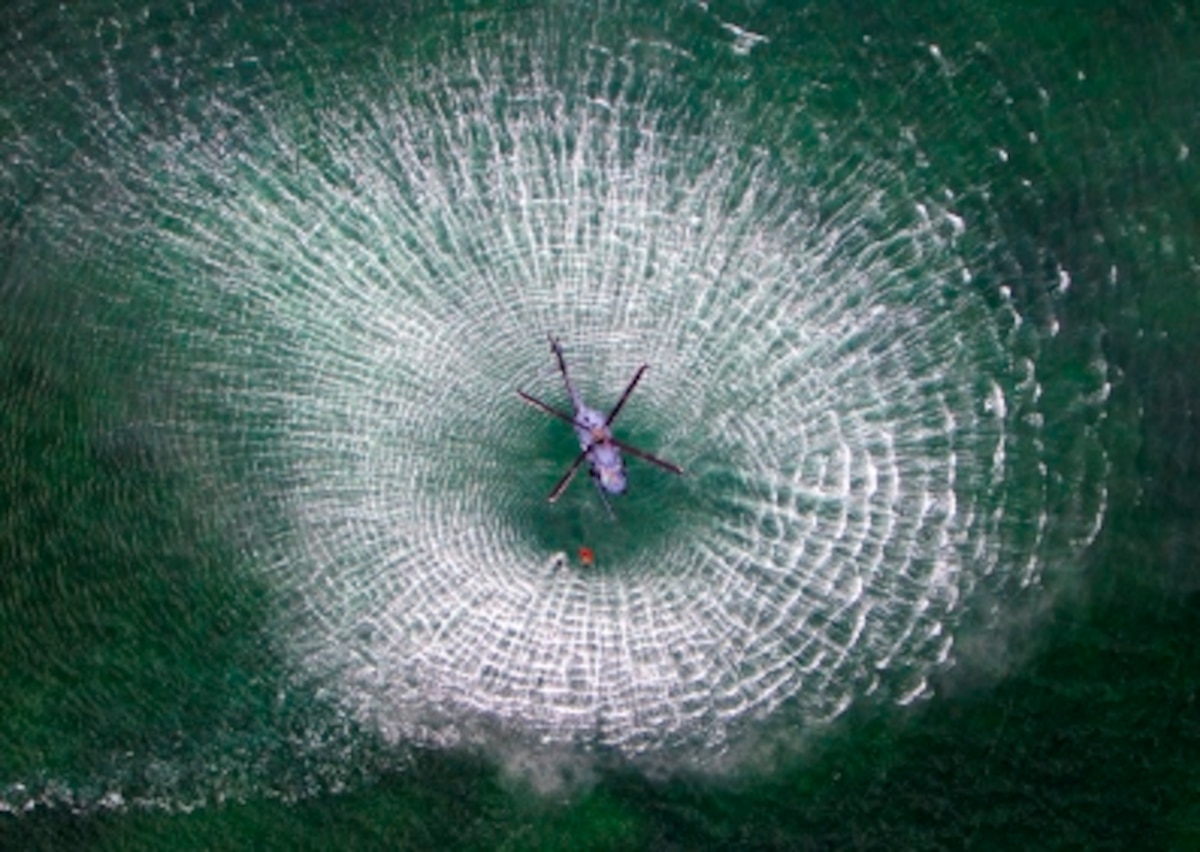 The PJs were hoisted down, attached the pilot and were lifted up while the HH-60 Pave Hawk hovered over head during water survival training at Naval Air Station Key West, Florida on September 14 - 18, 2015. The joint exercise consisted of the 301st Fighter Wing, the 457th Fighter Squadron, both from Naval Air Station Fort Worth Joint Reserve Base, Texas, the 44th Fighter Group, Tyndall AFB, Fl., the 920th Rescue Wing, 308th Rescue Squadron, Patrick AFB, Fl., and Naval Air Station Key West Base Operations, Key West, Fl. (U.S. Air Force photo and graphic/Lt. Col. Jeremy Boyd)