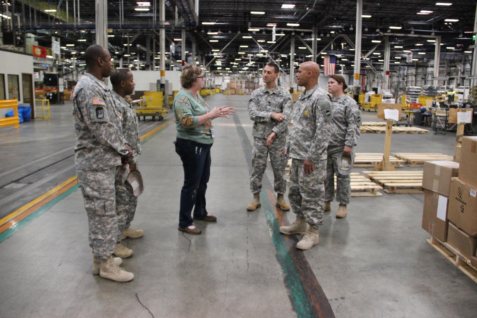 Sherre Mitten-Bell, center, leads the Army’s 6th Medical Logistics Management Center through DLA Distribution Susquehanna’s Eastern Distribution Center. Photo by Alex Wypijewski.