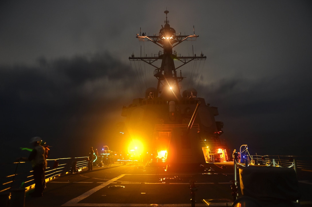 U.S. sailors on the USS Lassen conduct a man-overboard drill in the South China Sea, Sept. 28, 2015. The Lassen is on patrol in the U.S. 7th Fleet area of operation supporting security and stability in the Indo-Asia-Pacific region. U.S. Navy photo by Petty Officer 2nd Class Corey T. Jones
