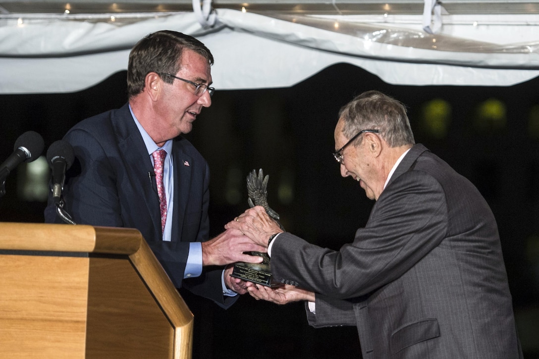 Defense Secretary Ash Carter presents the award for inaugural Innovators in Defense, Enterprise, Academia and Science to former Defense Secretary William Perry during the World Economic Forum dinner at the Pentagon, Sept. 30, 2015. DoD photo by U.S. Senior Master Sgt. Adrian Cadiz