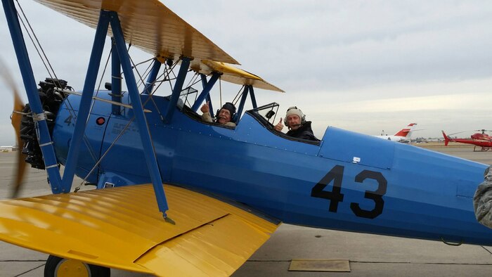 Maynard Nelson, a WWII veteran (left) and Lt. Col. Andrew McVicker, 9th Operations Group deputy commander (right) give a ‘thumbs-up’ as they taxi out to the runway at McClellan Airfield, California, Sept. 30, 2015. McVicker flew eight volunteers from the Aerospace Museum of California after they watched his plane while he was deployed. (U.S. Air Force photo by Staff Sgt. Robert Trujillo)