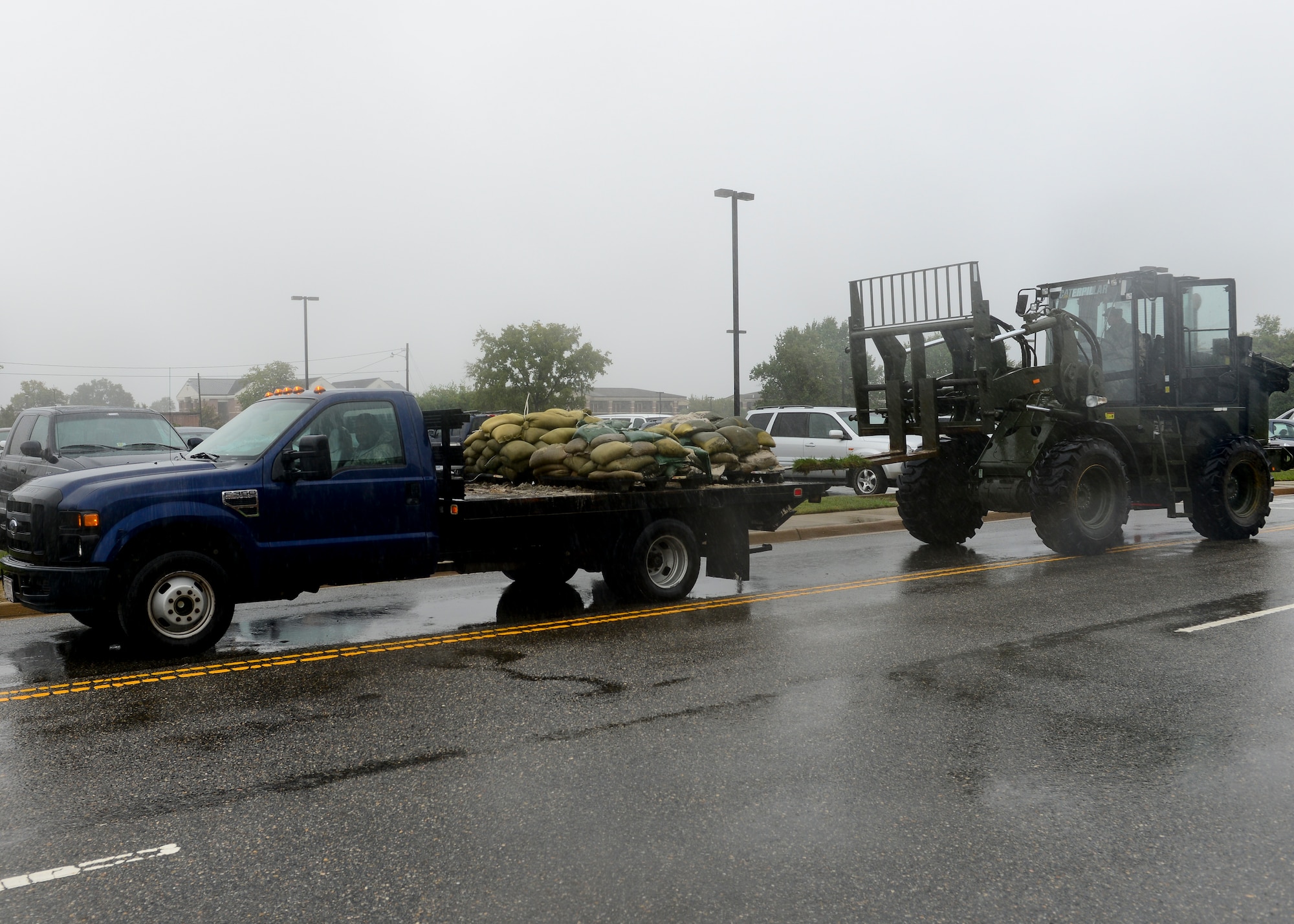 A truck carrying sandbags waits to be unloaded at Langley Air Force Base, Va., Oct. 1, 2015. Preparations are a result of potential flooding from Hurricane Joaquin. (U.S. Air Force photo by Airman 1st Class Derek Seifert/ Released)