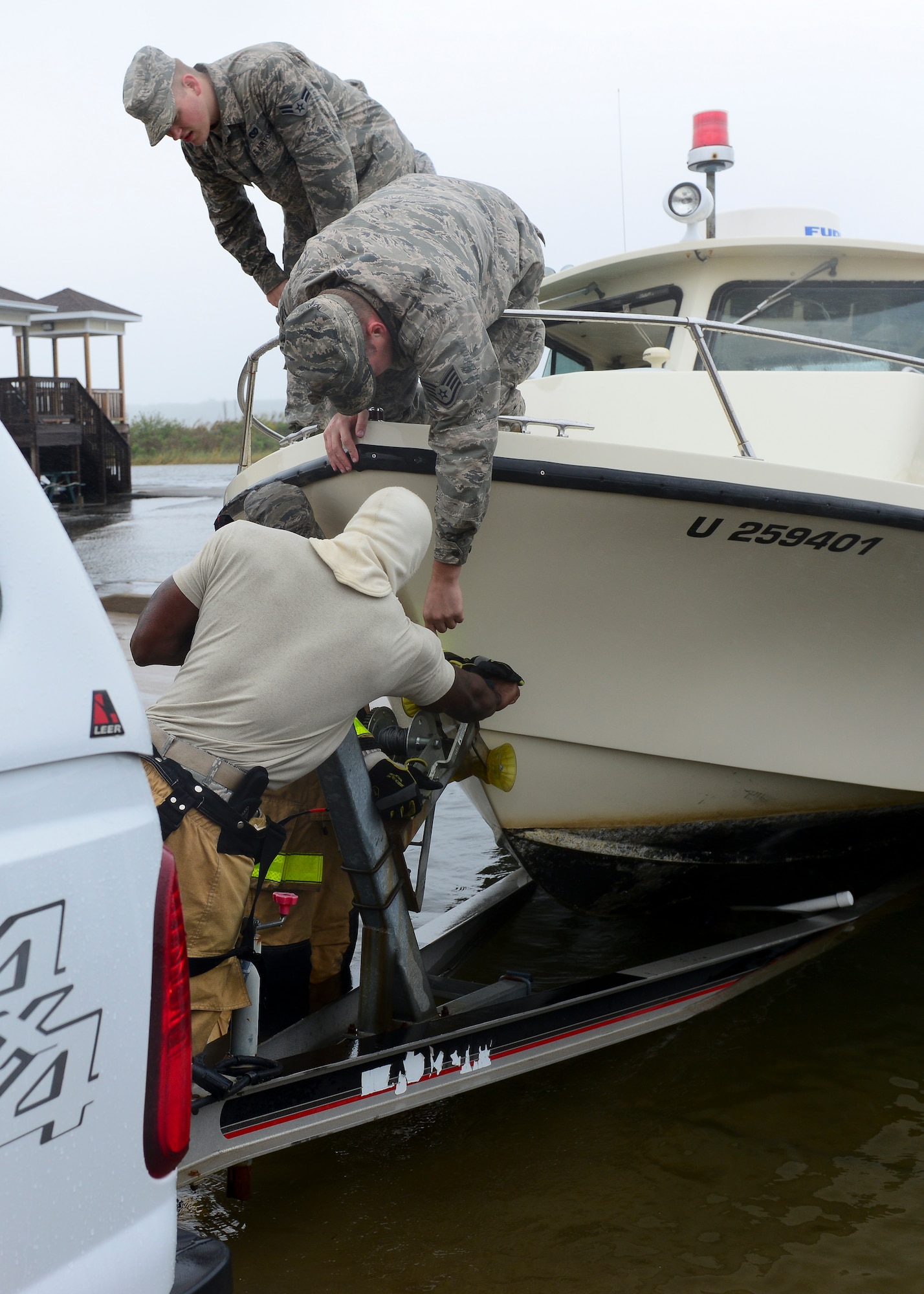 U.S. Air Force Airmen prepare to tow a rescue boat from the Langley Marina at Langley Air Force Base, Va., Oct. 1, 2015. The installation began preparation efforts in anticipation of heavy precipitation, high winds, storm surges and flooding associated with Hurricane Joaquin. (U.S. Air Force photo by Airman 1st Class Derek Seifert/ Released)