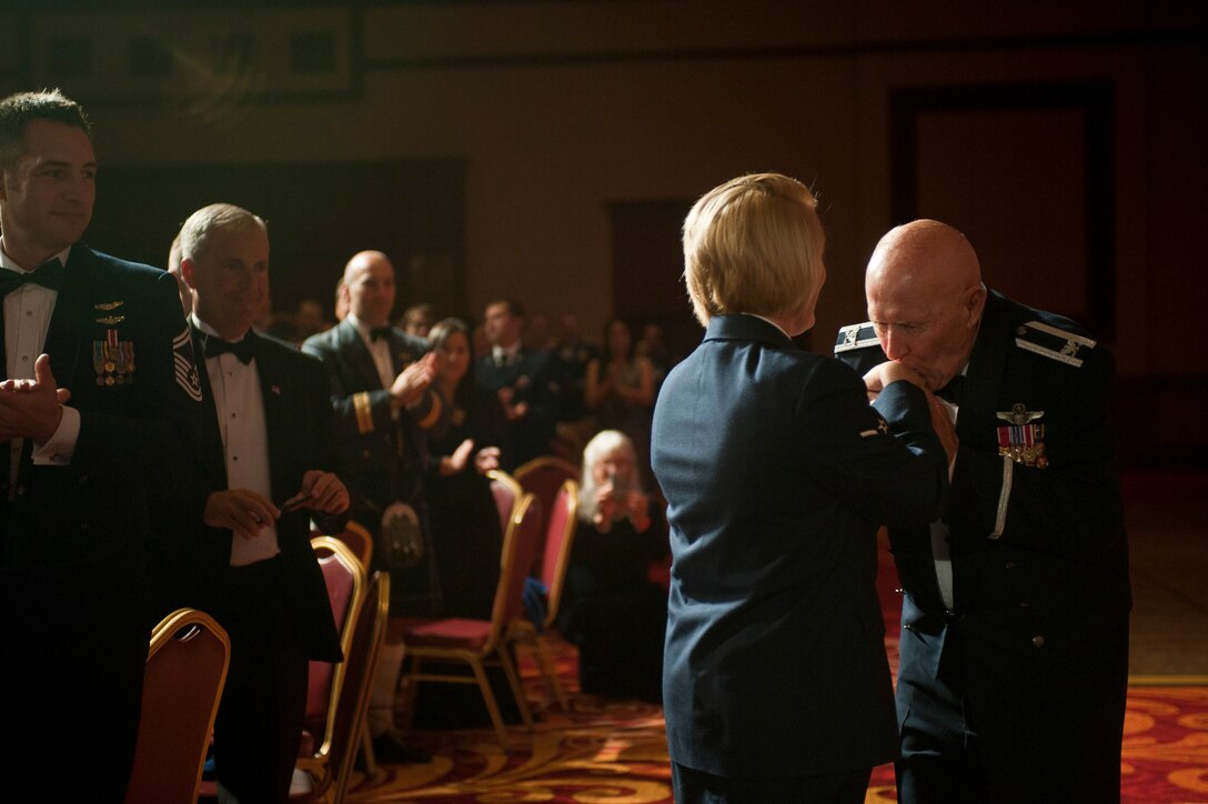 Retired Col. George Peterson greets Airman Brenna Albright during the 2015 Las Vegas Air Force Ball at the South Point Hotel and Casino in Las Vegas, Sept. 26, 2015. Peterson and Albright were the oldest and youngest past or present uniformed Airman in attendance. (U.S. Air Force photo by Staff Sgt. Siuta B. Ika)