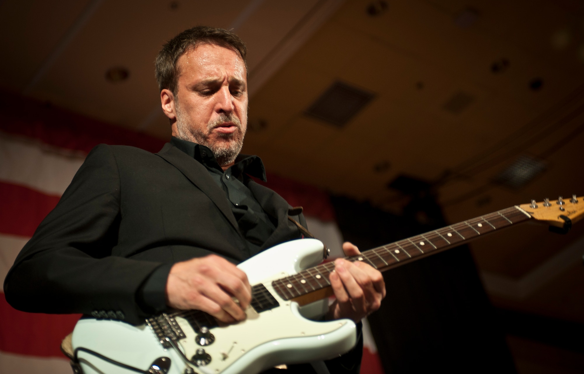 A guitar player in Matt Goss’ seven-piece band performs during the 2015 Las Vegas Air Force Ball at the South Point Hotel and Casino in Las Vegas, Sept. 26, 2015. The guitar player played a solo during a cover of the Eagles song “Hotel California”. (U.S. Air Force photo by Staff Sgt. Siuta B. Ika)