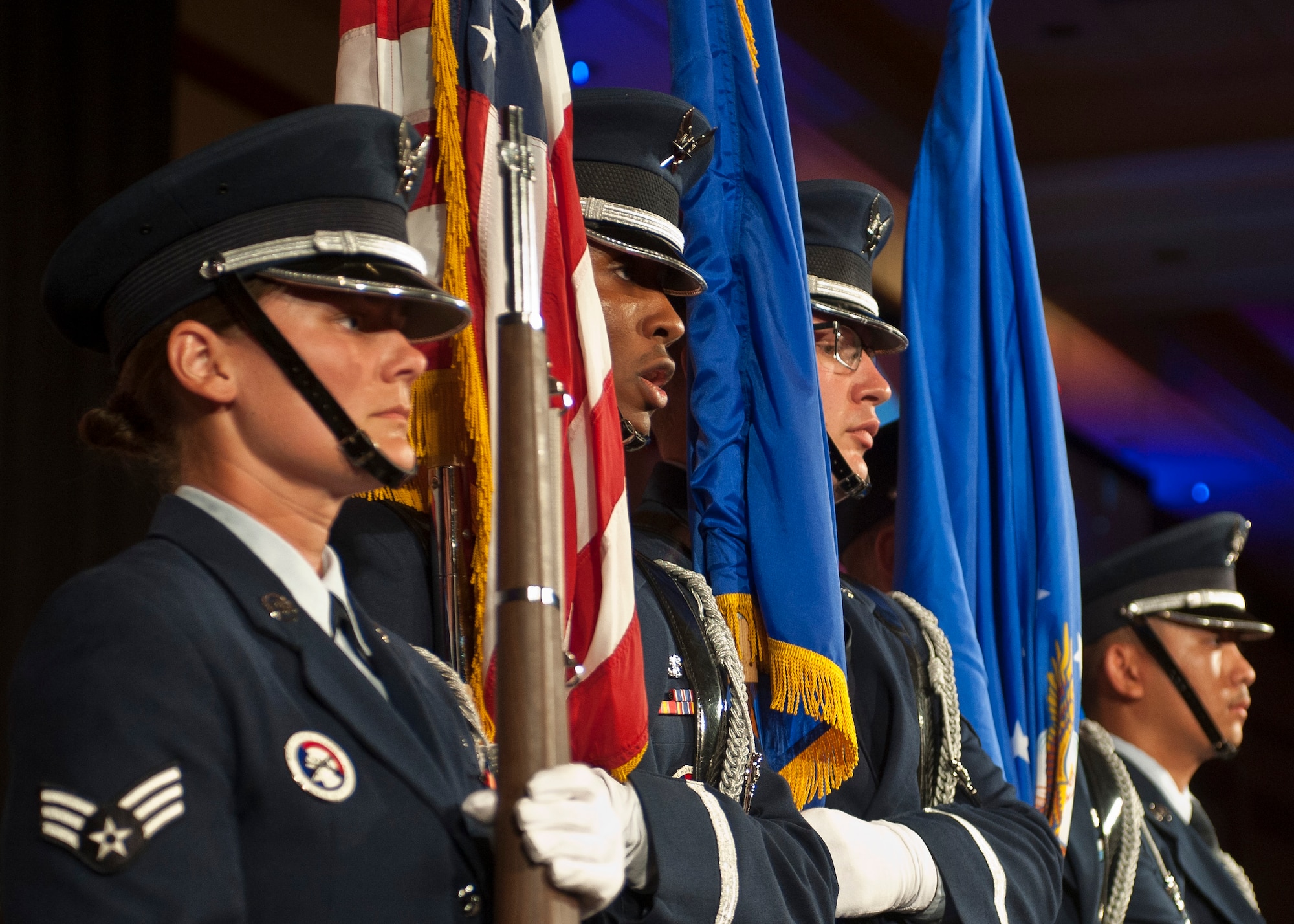 Members of the Nellis Air Force Base Honor Guard prepare to retire the colors during the 2015 Las Vegas Air Force Ball at the South Point Hotel and Casino in Las Vegas, Sept. 26, 2015. In addition to presenting and retiring the colors, the Honor Guardsmen performed a Missing Man Table and Honors ceremony to pay respects to members of the U.S. armed forces who are/were prisoners of war or missing in action. (U.S. Air Force photo by Staff Sgt. Siuta B. Ika)
