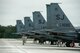 Four F-15E Strike Eagles from the 335th Fighter Squadron receive final checks before take-off, Oct. 1, 2015, at Seymour Johnson Air Force Base, North Carolina. Due to inclement weather coming in from Hurricane Joaquin, jets were relocated to Barksdale AFB, Louisiana to avoid the storm. (U.S. Air Force photo/Airman Shawna L. Keyes)