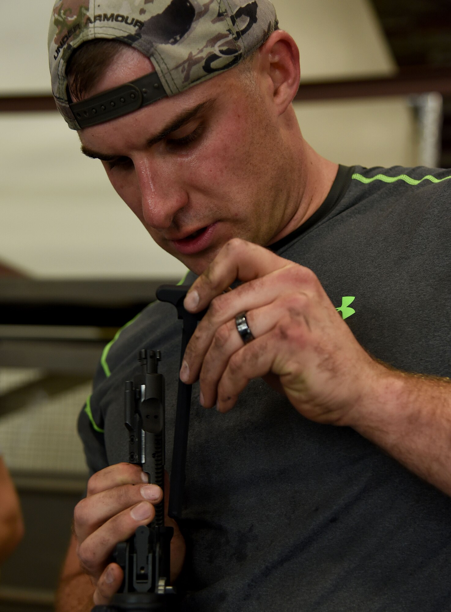 Staff Sgt. Adam Wriglesworth, 92nd Aerospace Medicine Squadron bioenvironmental engineering craftsman, assembles an M4 Carbine Assault Rifle during the weapons familiarization portion of the AMDS Monster Mash Sept. 30, 2015, at Fairchild Air Force Base, Wash. The AMDS Monster Mash consisted of six different stations of mission training that participants needed to complete in a timed scenario. (U.S. Air Force photo/Senior Airman Janelle Patiño)