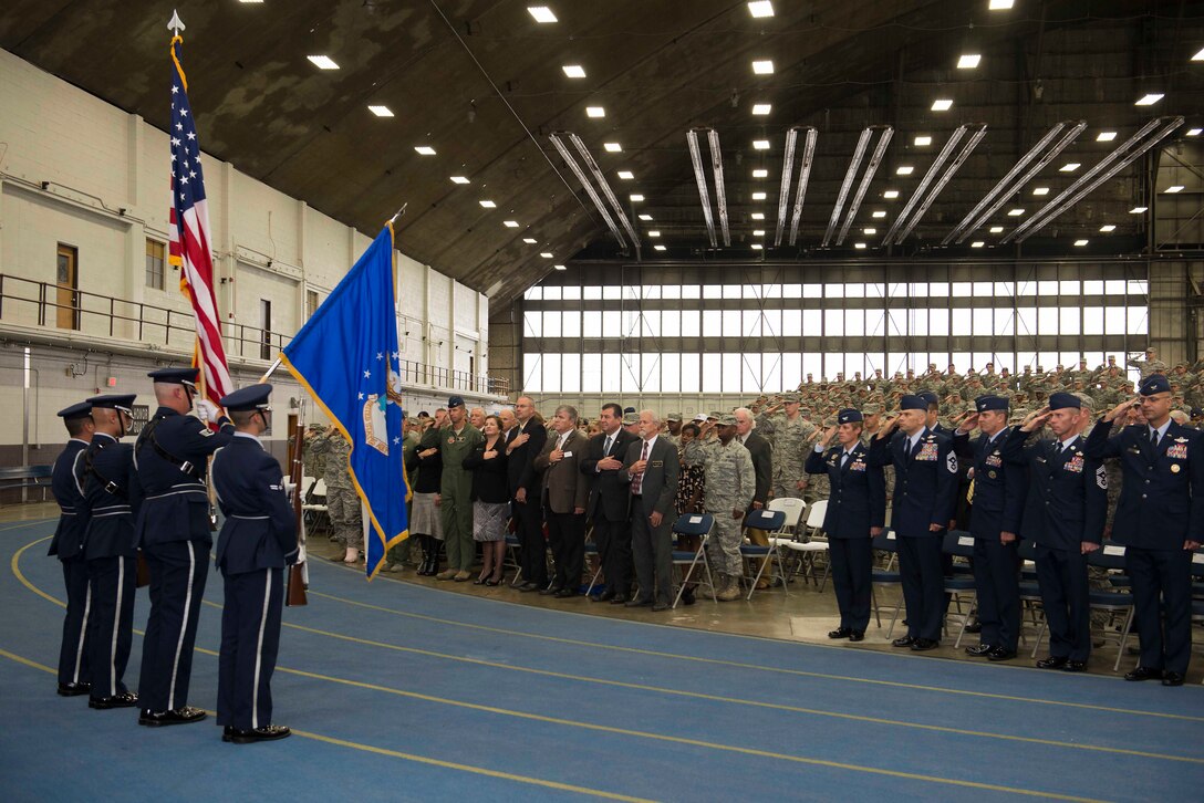 The Ellsworth Honor Guard presents the colors during the National Anthem at the B-1 realignment ceremony at Ellsworth Air Force Base, S.D., Sept. 28, 2015. B-1 bomber fleets from Ellsworth and Dyess AFB, Texas, are transitioning from Air Combat Command to Air Force Global Strike Command, joining the B-52 Stratofortress and B-2 Spirit in one command.  (U.S Air Force photo by Senior Airman Rebecca Imwalle/Released)