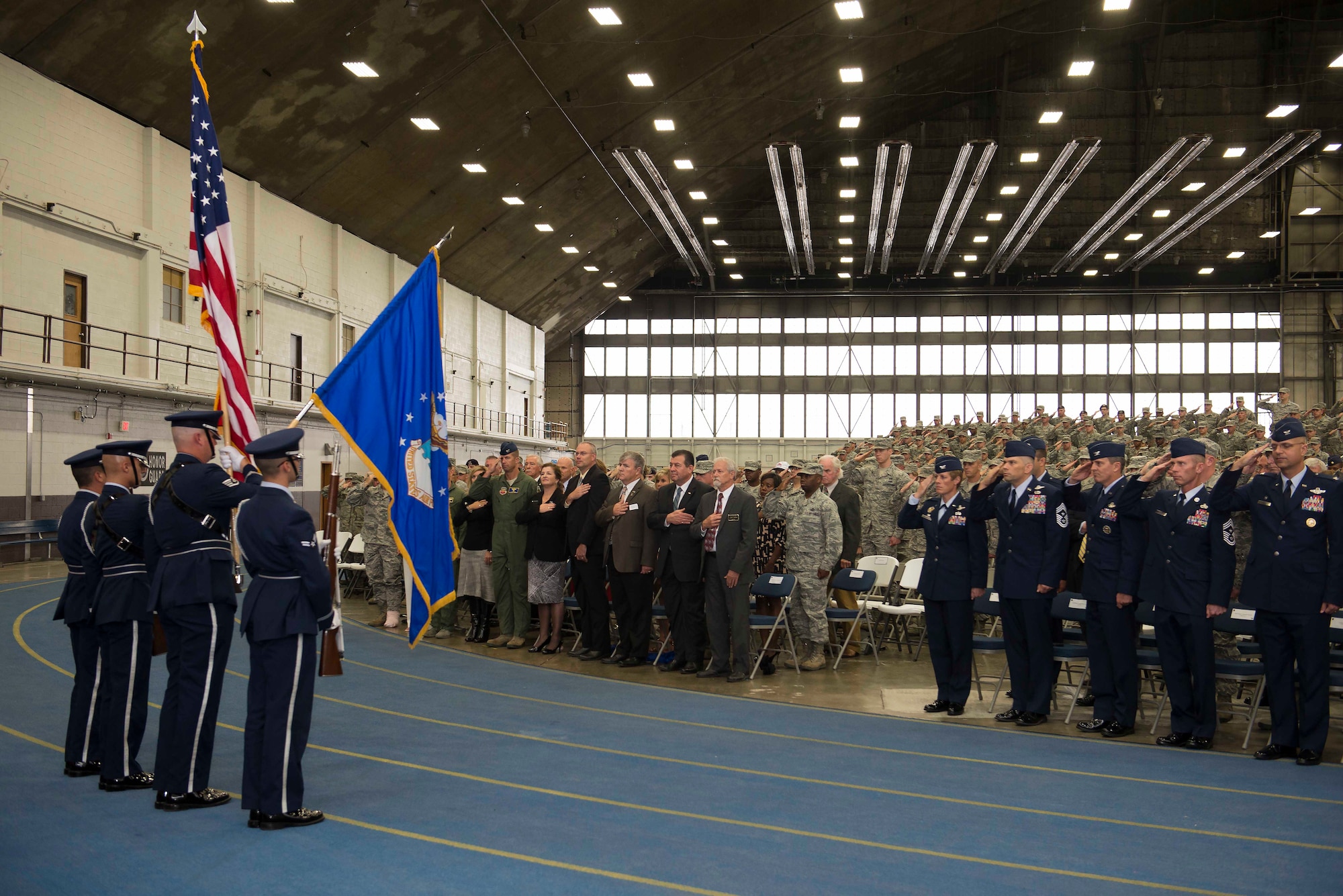 The Ellsworth Honor Guard presents the colors during the National Anthem at the B-1 realignment ceremony at Ellsworth Air Force Base, S.D., Sept. 28, 2015. B-1 bomber fleets from Ellsworth and Dyess AFB, Texas, are transitioning from Air Combat Command to Air Force Global Strike Command, joining the B-52 Stratofortress and B-2 Spirit in one command.  (U.S Air Force photo by Senior Airman Rebecca Imwalle/Released)
