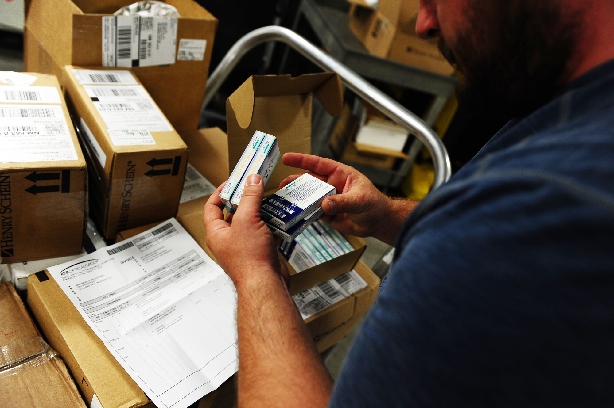 Herbert Carrillo, a medical logistics technician with the 49th Medical Logistics Flight, checks the labels on prescription contacts as he packs them into boxes inside the Medlog warehouse Aug. 14. Medlog is responsible for ordering all supplies, prescriptions and equipment for the medical clinic. (U.S. Air Force photo by Airman 1st Class Randahl J. Jenson)