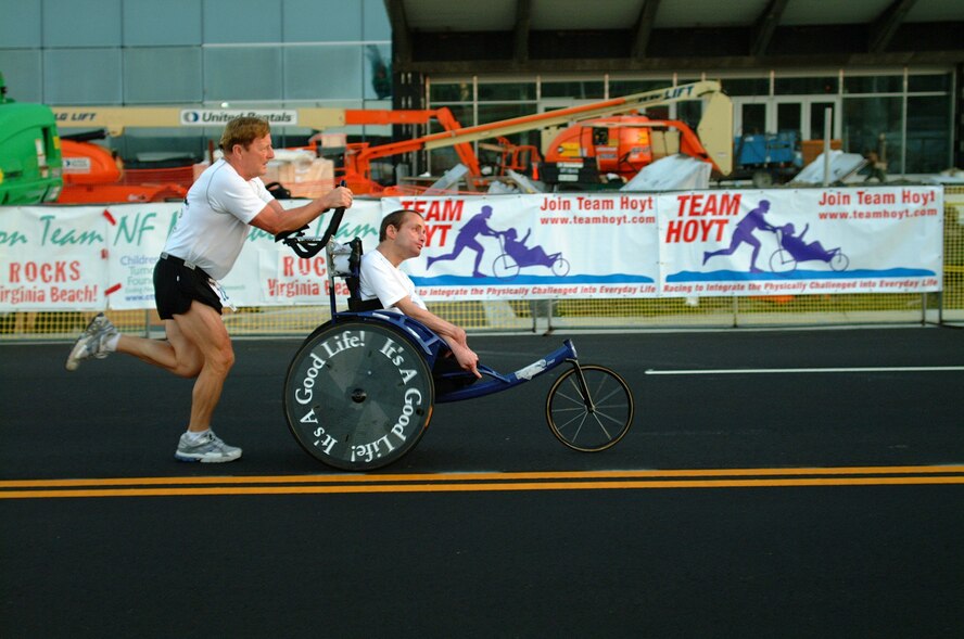 Team Hoyt, comprised of father-and-son duo Dick Hoyt, left, and Rick Hoyt, competes at the Virginia Beach Rock 'n' Roll Half Marathon in 2006. The pair will speak at 1 p.m. and 3 p.m. Oct. 6 at the Base Theater at Travis Air Force Base, Calif. (Courtesy photo)