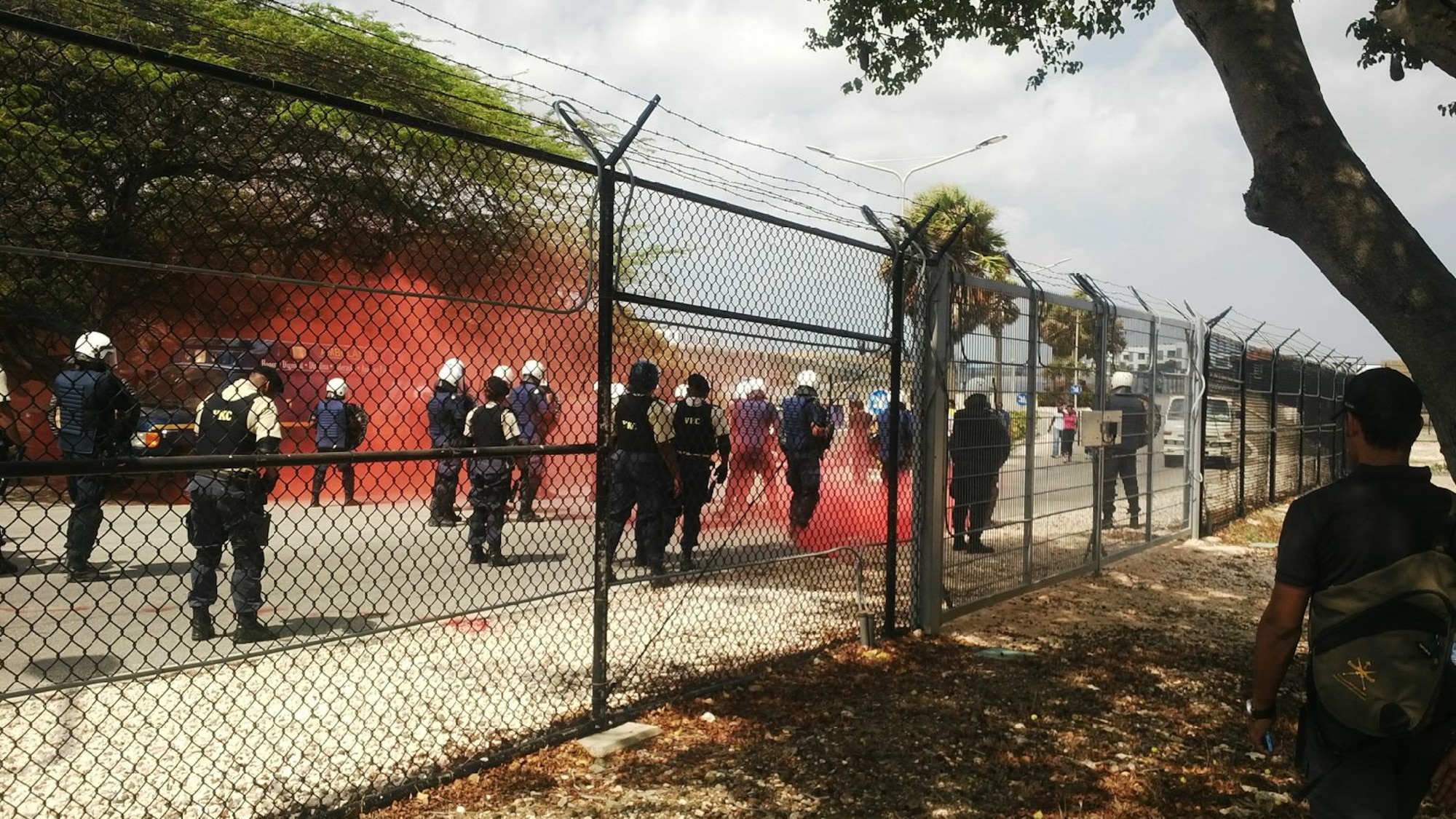 Members of the U.S. Forward Operation Location Curacao, Korps Police Curacao and the Vrijwilligers Korps Curacao, participated in a Joint Confrontation Management Riot Exercise at the U.S. Forward Operation Location Curacao, Sept. 27, 2015.  This exercise brought three law enforcement agencies together in an effort to forge strong partnerships in protecting assets at the FOL and within the community.  The training exercise was approximately three hours long and resulted in successful joint riot exercise training for all parties involved.  This was the first exercise where all three agencies collaborated and worked together as a team to achieve all the training objectives.  All the agencies considered the exercise to be successful in preparing themselves for any type of future riot control measures that may occur. (Courtesy photo/Released) 