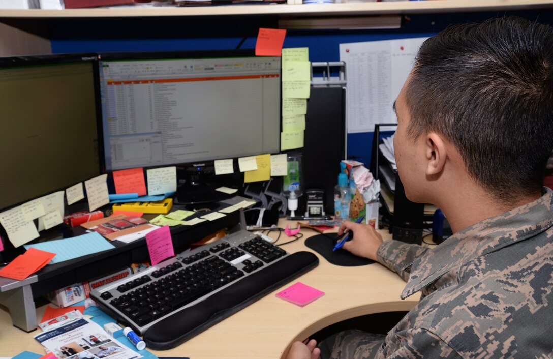 U.S. Air Force Senior Airman Leon Yang, 100th Comptroller Squadron budget analyst, reconsolidates vouchers to a spreadsheet Sept. 30, 2015, on RAF Mildenhall, England. Airmen from the 100th CPTS stayed after normal duty hours to allocate funding for the end of fiscal year close out. Each year the Air Force receives funding for defense - related expenditures that must be allocated by Sept. 30. The budget team and resource advisors accurately accounted for and balanced one of the largest budgets in the United States Air Forces in Europe totaling $293 million. (U.S. Air Force photo by Senior Airman Christine Halan/Released)