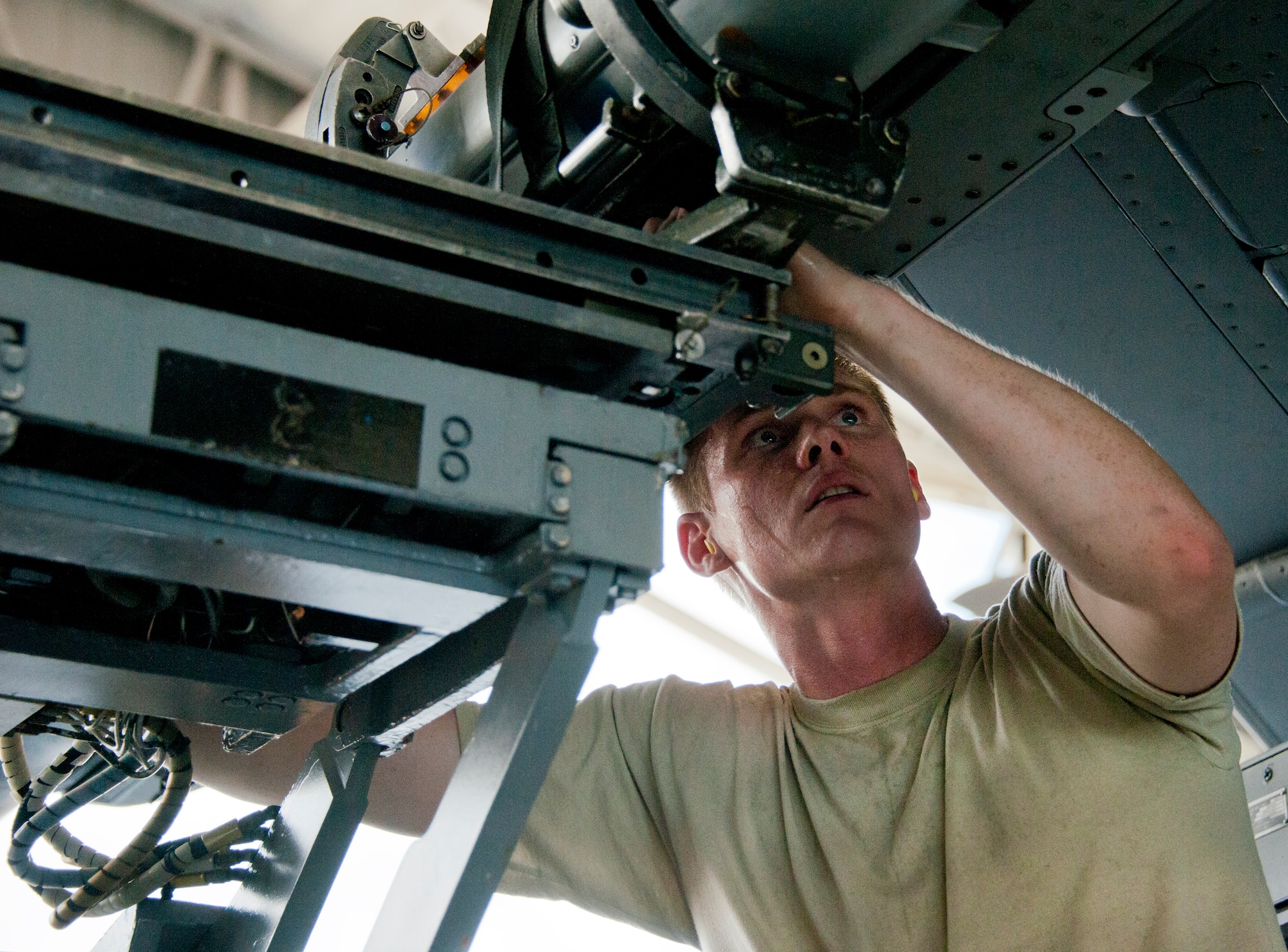 Staff Sgt. Robert Biederman, 96th Aircraft Maintenance Squadron Blue, ensures the missile is in place on an F-16 Fighting Falcon during the third quarter loadcrew competition Sept. 30 at Eglin Air Force Base, Fla.  The AMU-Red F-15 team won the competition, loading three missiles in the quickest time with the fewest discrepancies.  (U. S. Air Force photo/Samuel King Jr.)