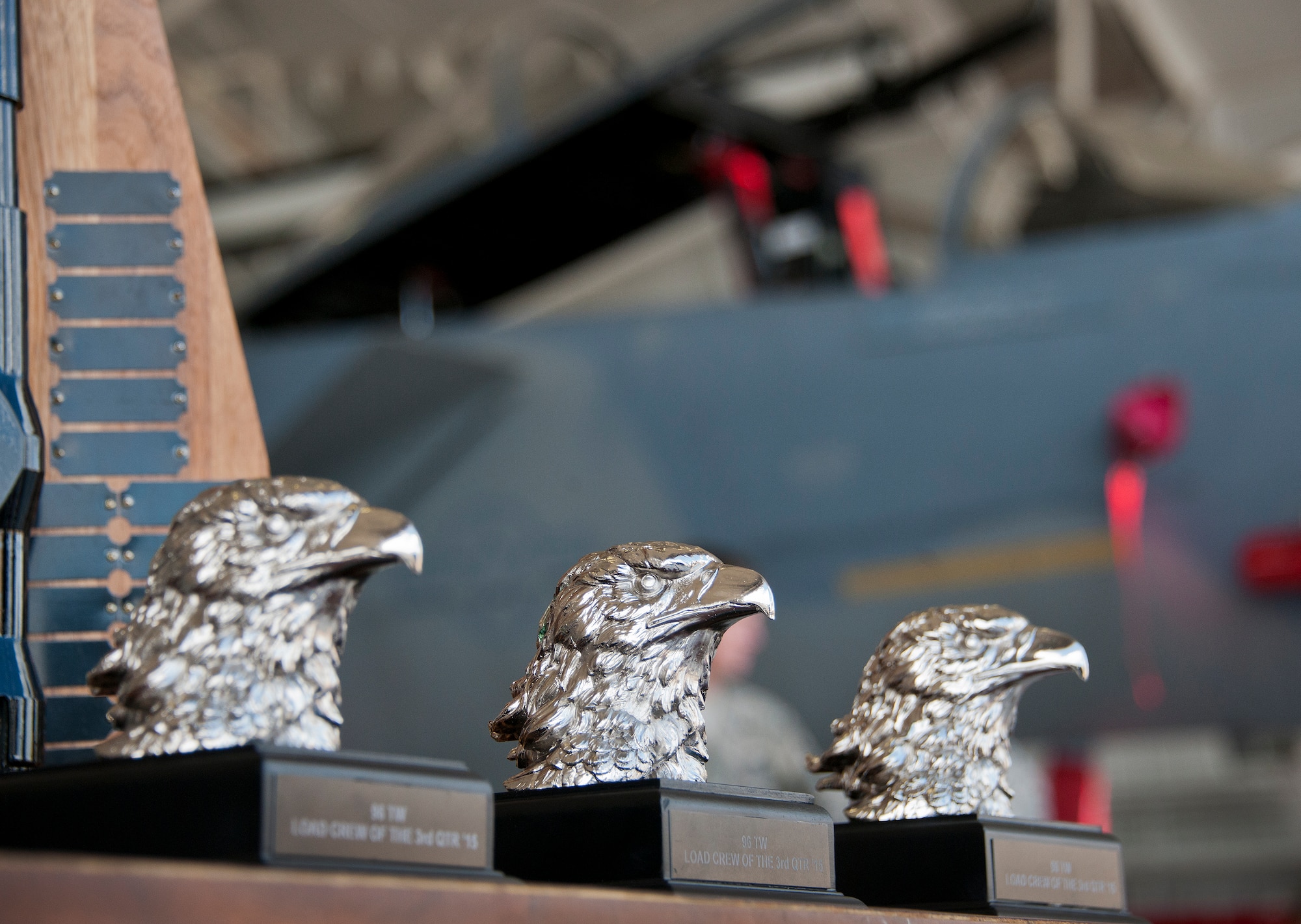 The third quarter Loadcrew of the Quarter trophies await the winners of the weapons load competition between the 96th Aircraft Maintenance Squadron’s Red F-15 team and the Blue F-16 team Sept. 30 at Eglin Air Force Base, Fla.  The Red team won the competition loading three missiles in the quickest time with the fewest discrepancies.  (U. S. Air Force photo/Samuel King Jr.)