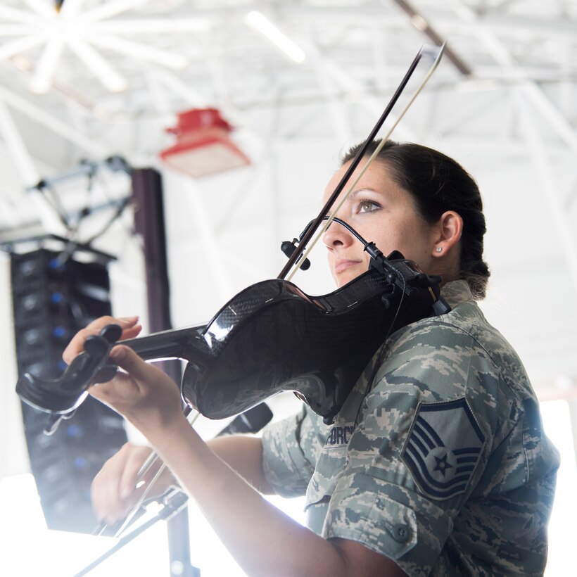 Master Sgt. Emily Wellington, both a Singing Sergeant and violinist with Celtic Aire, performs inside Hangar 3 on Joint Base Andrews, Md., during the 2015 Air Show, Sept. 19. (U.S Air Force photo by Airman 1st Class Philip Bryant/Released)

