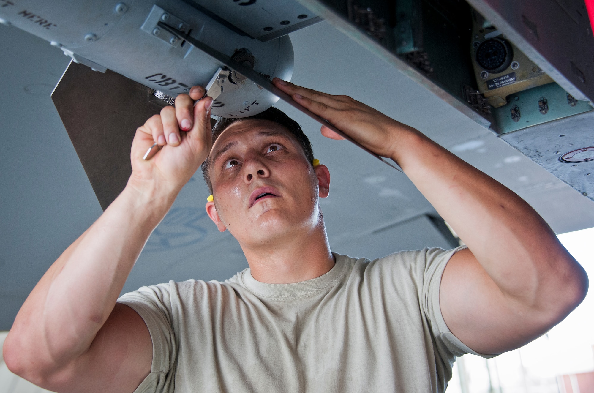 Staff Sgt. Vincent Franco, 96th Aircraft Maintenance Squadron Red, tightens down a fin onto a missile during the third quarter loadcrew competition Sept. 30 at Eglin Air Force Base, Fla.  The Red team won the competition loading three missiles onto their F-15 Eagle in the quickest time with the fewest discrepancies.  (U. S. Air Force photo/Samuel King Jr.)