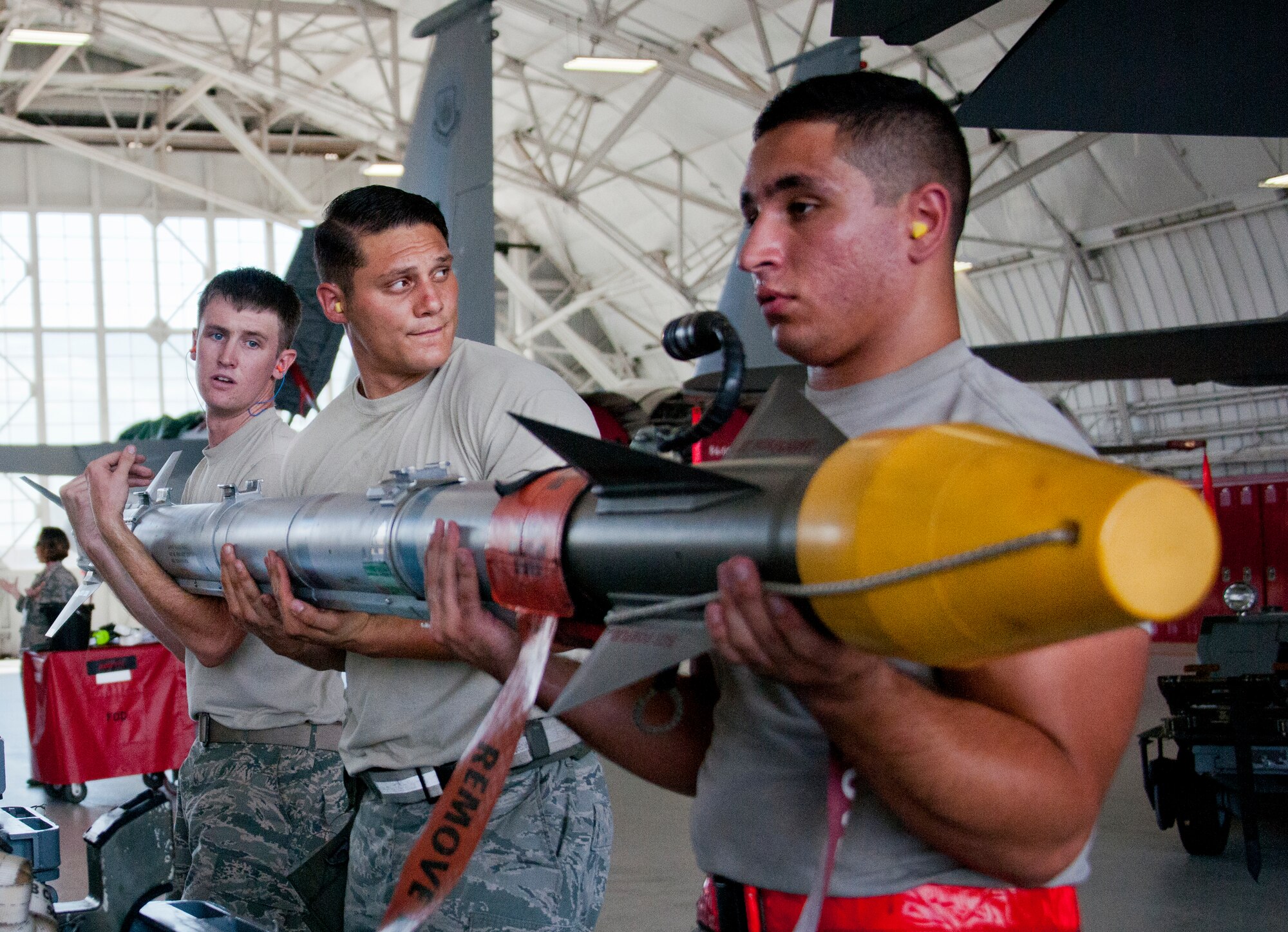 The 96th Aircraft Maintenance Squadron Red team moves a missile away from its trailer toward their F-15 Eagle during the third quarter loadcrew competition Sept. 30 at Eglin Air Force Base, Fla.  The Red team won the competition loading three missiles in the quickest time with the fewest discrepancies.  (U. S. Air Force photo/Samuel King Jr.)