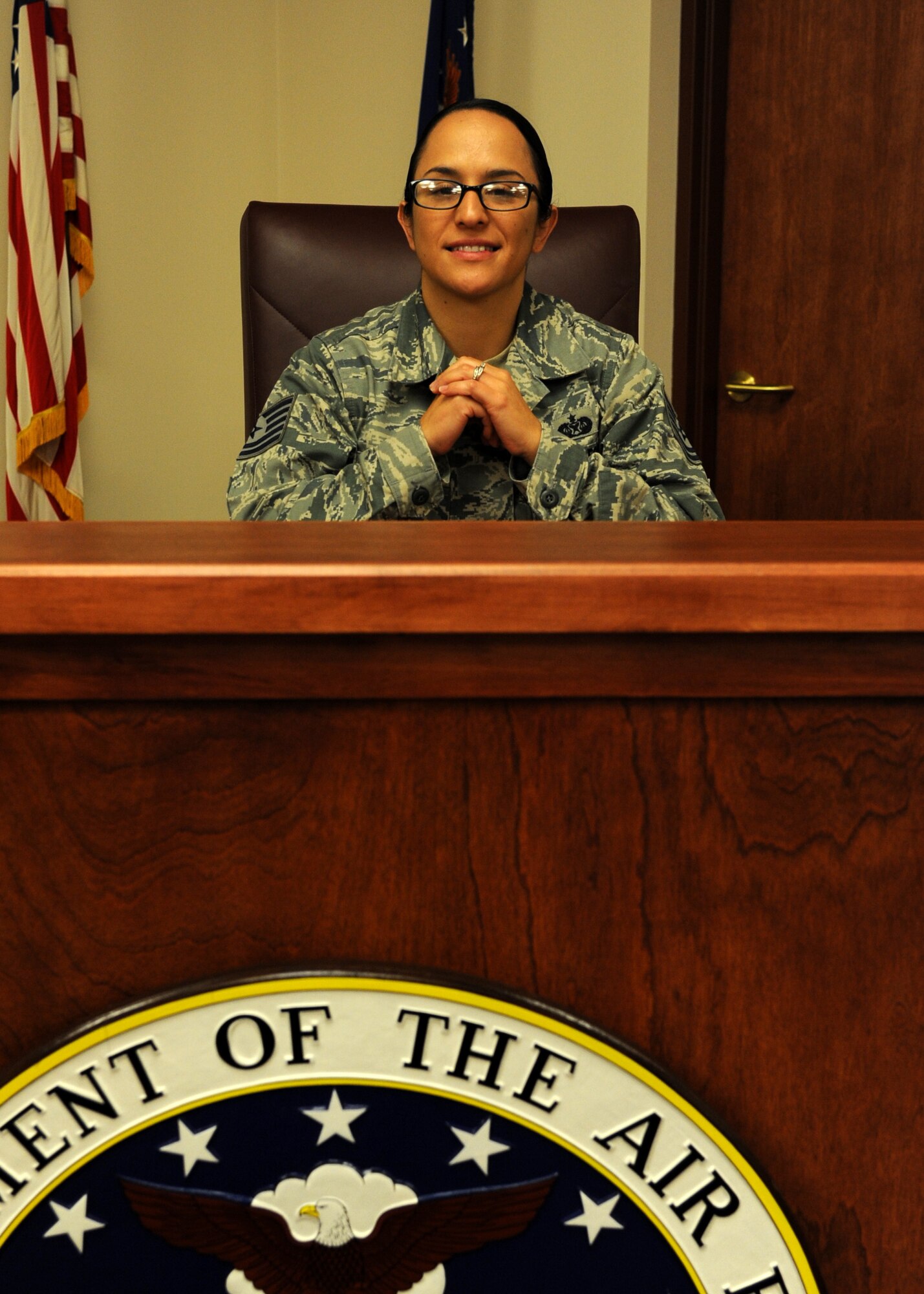 Tech. Sgt. Crystal Lopez, 319th Air Base Wing legal office NCO-in-charge, poses for a picture in the courtroom Sept. 30, 2015, on Grand Forks Air Force Base, North Dakota. Lopez was selected as the Warrior of the Week for the first week of October 2015. (U.S. Air Force photo by Airman 1st Class Ryan Sparks/Released)
