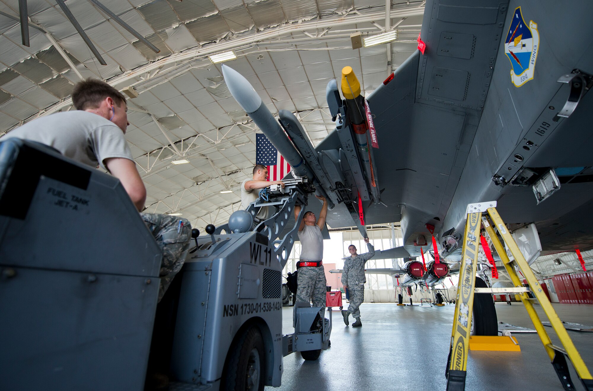 The 96th Aircraft Maintenance Squadron Red team secures a missile on their F-15 Eagle during the third quarter loadcrew competition Sept. 30 at Eglin Air Force Base, Fla.  The Red team won the competition loading three missiles in the quickest time with the fewest discrepancies.  (U. S. Air Force photo/Samuel King Jr.)