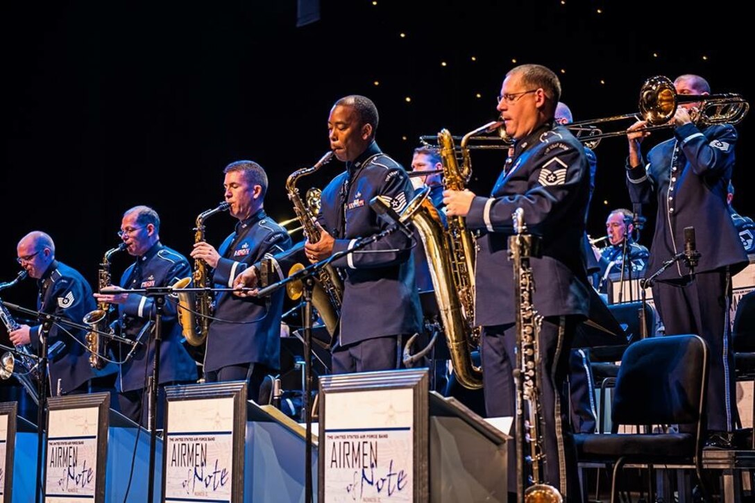 The Airmen of Note saxophone and trombone sections stand for a solo section during a recent performance at Pasquerilla Performing Arts Center in Johnstown, Pennsylvania.  The group just returned from a short community relations tour to Pennsylvania that included several performances and a clinic for area high school students. (U.S. Air Force photo by Staff Sgt. Mike
Fariss/released)
