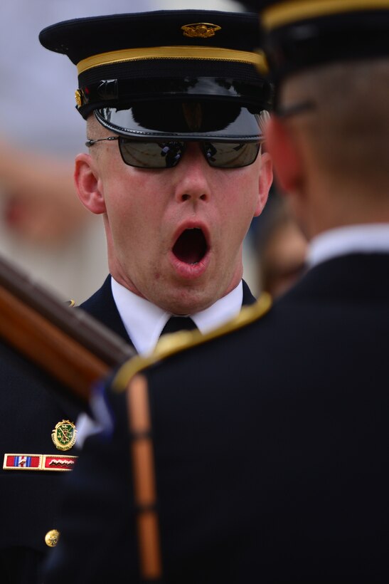 A U.S. Army 3rd U.S. Infantry Regiment (The Old Guard) relief commander relieves a soldier of guarding the Tomb of the Unknown Soldier before the Gold Star Mother’s Day Observance at Arlington National Cemetery in Arlington, Va., Sept. 27, 2015.  After changing guard, the relief commander announced the start of the Gold Star Mother’s Day wreath-laying ceremony. (U.S. Air Force photo by Staff Sgt. Natasha Stannard/Released)