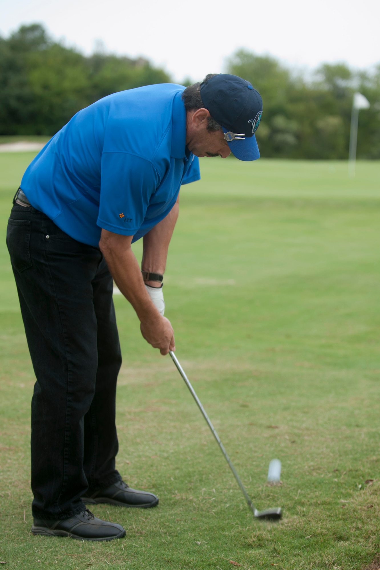 Mark Sciacchitano, 733rd Civil Engineer Squadron civil engineer, chips a golf ball toward the green during the Commander’s Cup golf tournament at Eaglewood Golf Course at Langley Air Force Base, Va., Sept. 25, 2015. The 18-hole competition pitted teams of four against each other to vie for the top spot. (U.S. Air Force photo by Senior Airman R. Alex Durbin/Released)