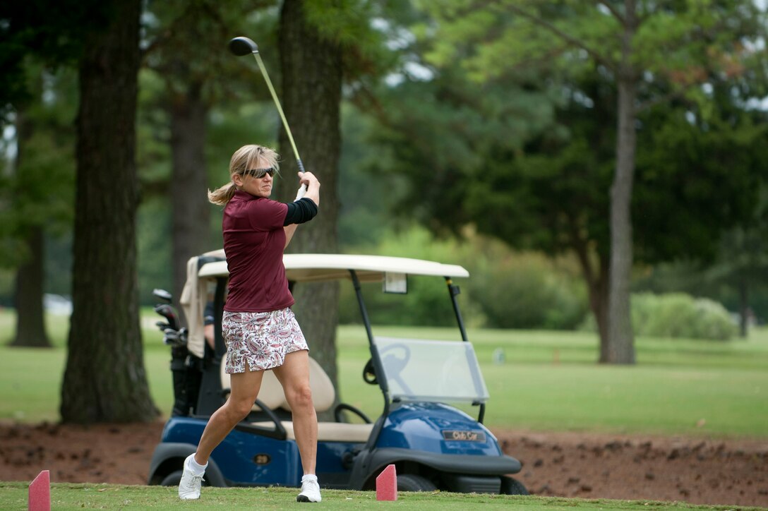 U.S. Air Force Col. Caroline Miller, 633rd Air Force Base Wing commander, drives a golf ball during the Commander’s Cup golf tournament at Eaglewood Golf Course at Langley Air Force Base, Va., Sept. 25, 2015. The event gathered both civilian personnel and Service members of all ranks to compete on the 18-hole course. (U.S. Air Force photo by Senior Airman R. Alex Durbin/Released)