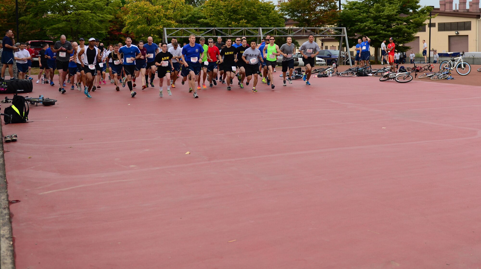 Competitors take off as a race combining both running and cycling commences during the second annual base-wide competition at Osan Air Base, Republic of Korea, Sept. 30, 2015. The Osan Cup is a two-day contest with a variety of events designed to play to different strengths and promote healthy competition.
(U.S. Air Force photo/Staff Sgt. Amber Grimm)