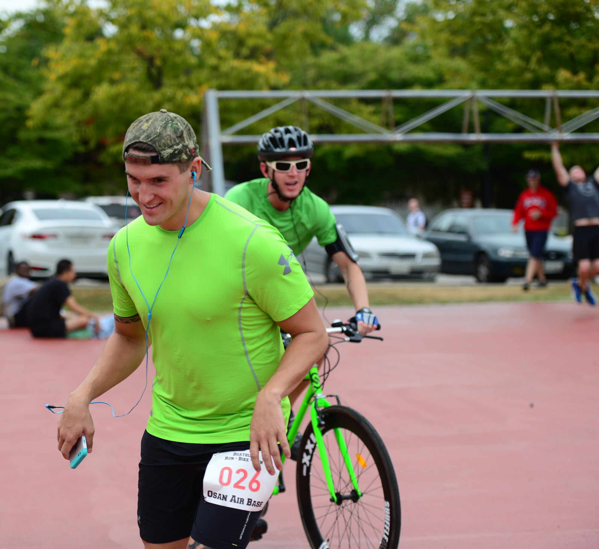 A runner takes off as his team member cycles in during a dual component race held as part of the second annual Osan Cup held at Osan Air Base, Republic of Korea, Sept. 30, 2015. Competing either alone or as a member of a team the participants contributed to their squadrons overall standing during the two-day event.
(U.S. Air Force photo/Staff Sgt. Amber Grimm)