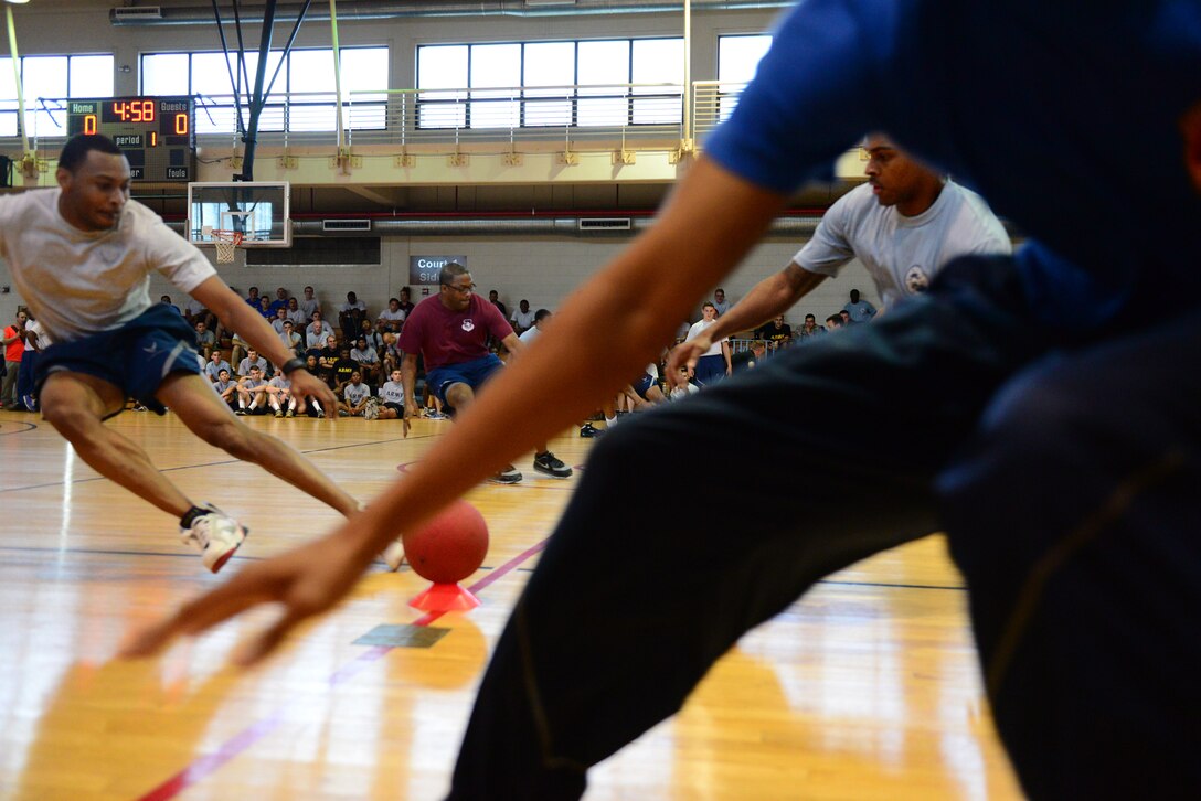 Airmen race to the line to claim the limited ammunition supplied for the all-out war of dodgeball during the second annual Osan Cup held at Osan Air Base, Republic of Korea, Sept. 30, 2015. The Osan cup is a sport-oriented, two-day event that puts squadrons and service members against each other in a battle royal to show who has the most skill, strength and knowledge. 
(U.S. Air Force photo/Staff Sgt. Amber Grimm)