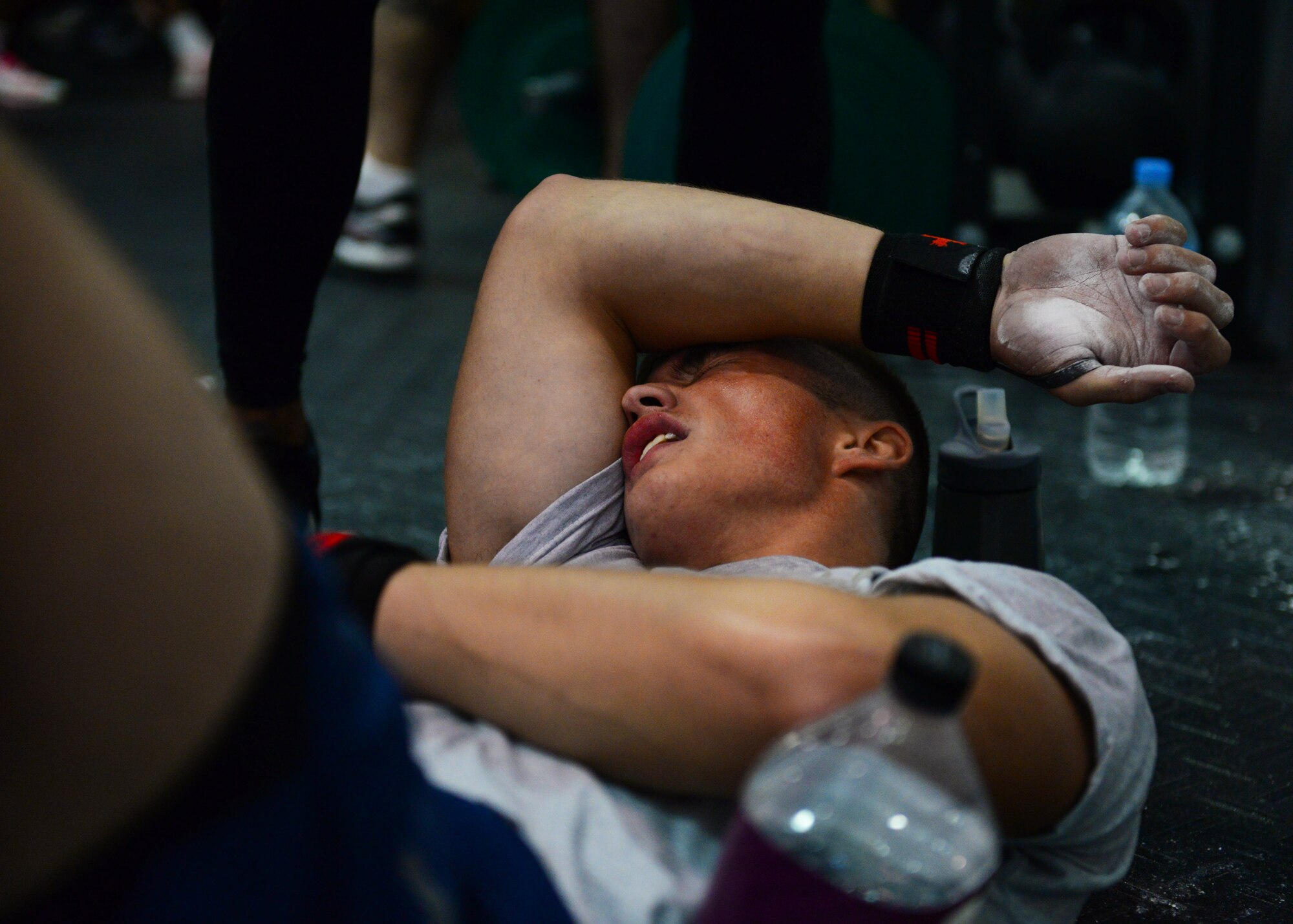 Airman Russell Morris, 51st Security Forces Squadron, takes a break after completing a grueling set of high-intensity strength and conditioning exercises as part of a challenge held at Osan Air Base, Republic of Korea, Sept. 30, 2015. The second annual Osan Cup is a two-day contest with a variety of events designed to play to different strengths and promote healthy competition.
(U.S. Air Force photo/Staff Sgt. Amber Grimm)