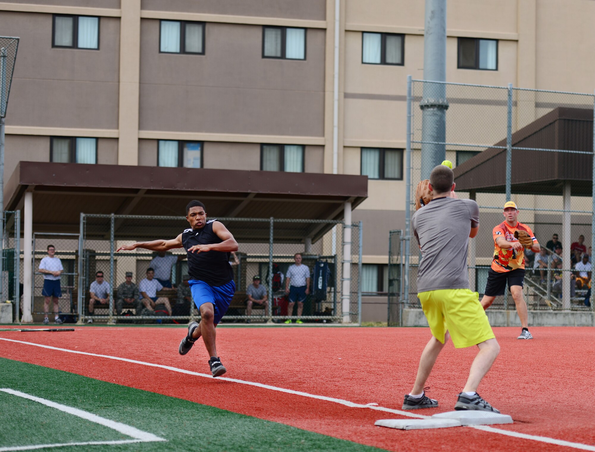 Staff Sgt. Justin McCallus, 51st Aircraft Maintenance Squadron, scores an out against an Airman from the 51st Logistic Readiness Squadron as the two teams compete at Osan Air Base, Republic of Korea, Sept. 29, 2015. Softball was just one of the 19 different events that made up the second annual Osan Cup.
(U.S. Air Force photo/Staff Sgt. Amber Grimm)