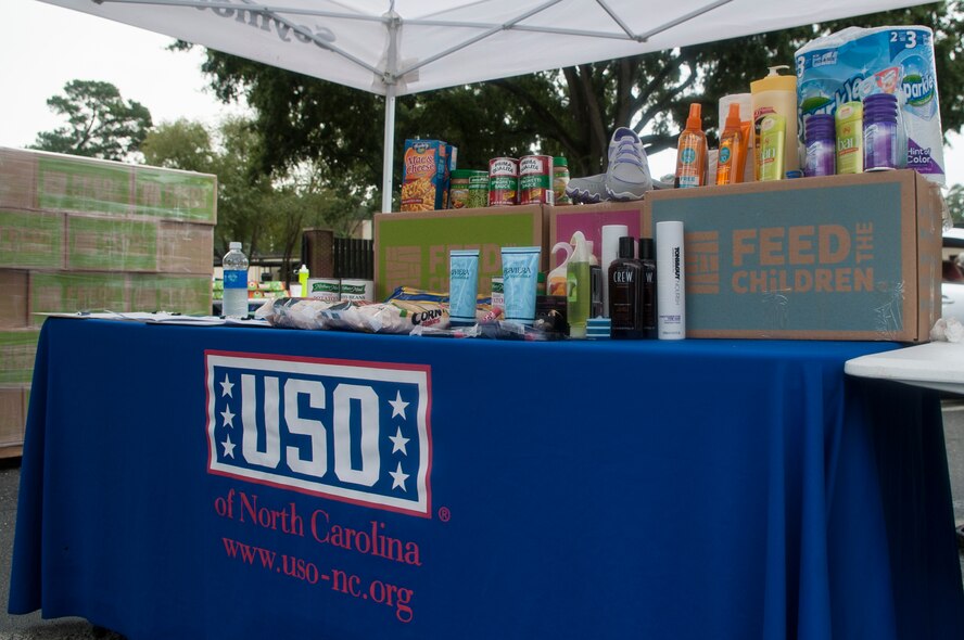Feed the Children partnered with the USO of North Carolina to provide dried goods, beauty products, and personal care items to Airmen and their families, Sept. 29, 2015, at Seymour Johnson Air Force Base, North Carolina. The First Sergeants Counsel planned the pick-up event and organized volunteers who helped hand out boxes. (U.S. Air Force photo/Airman Shawna L. Keyes) 