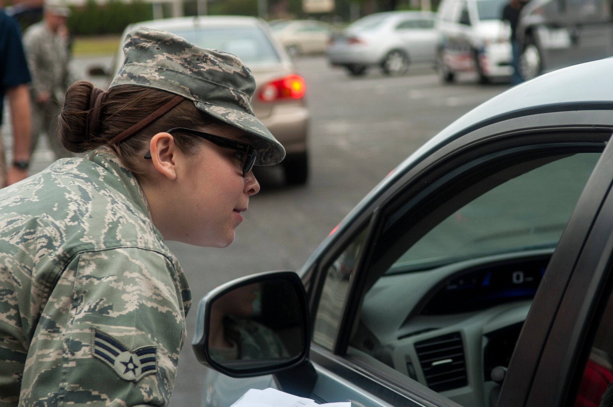 Senior Airman Wendy Fisher, 4th Force Support Squadron readiness and mortuary personnel, talks to a member of Team Seymour, Sept. 29, 2015, at Seymour Johnson Air Force Base, North Carolina. Fisher received vouchers from members of Team Seymour who were selected to receive free items donated from Feed the Children. (U.S. Air Force photo/Airman Shawna L. Keyes)  