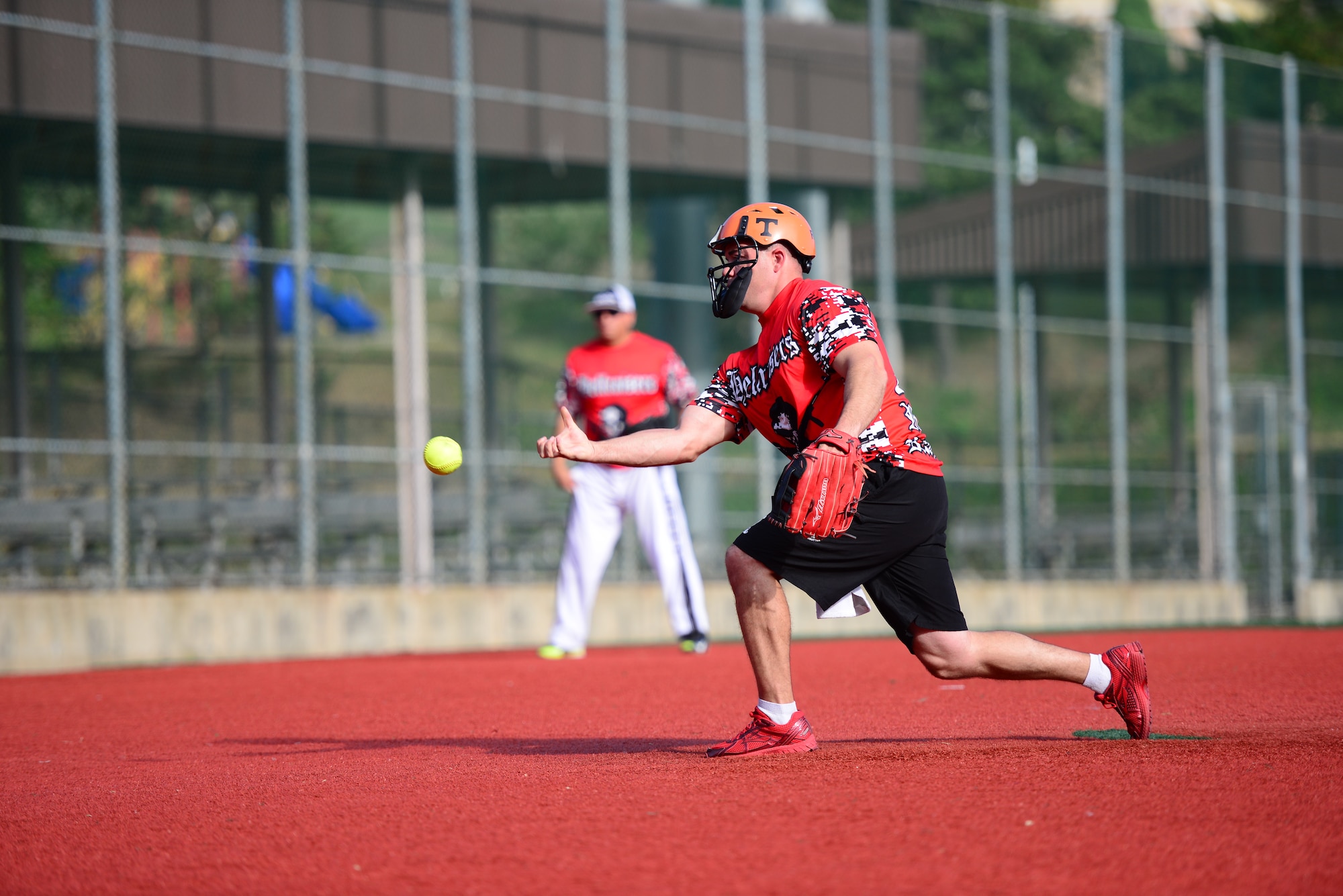 A Soldier from the 35th Air Defense Artillery Brigade pitches against an Airmen from the 51st Security Forces Squadron during a softball game at Osan Air Base, Republic of Korea, Sept. 29, 2015. The game was just one of the events Airmen and Soldiers competed in during the second annual Osan Cup.
(U.S. Air Force photo/Staff Sgt. Amber Grimm)