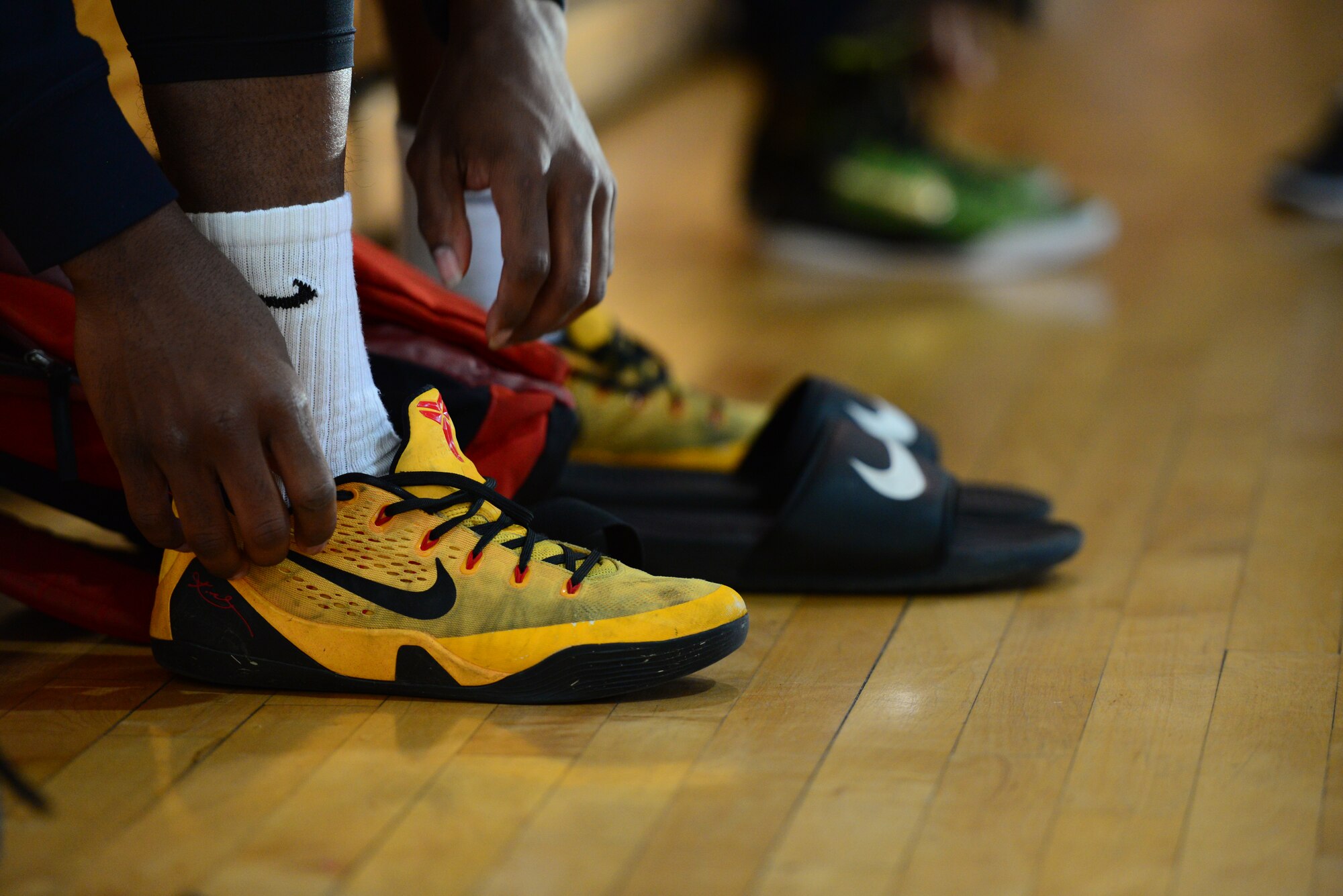A competitor laces up his shoes to hit the court at the 3-on-3 basketball challenge at Osan Air Base, Republic of Korea, Sept. 29, 2015. The challenge was just one of the events that took place during the second annual Osan Cup.
(U.S. Air Force photo/Staff Sgt. Amber Grimm)