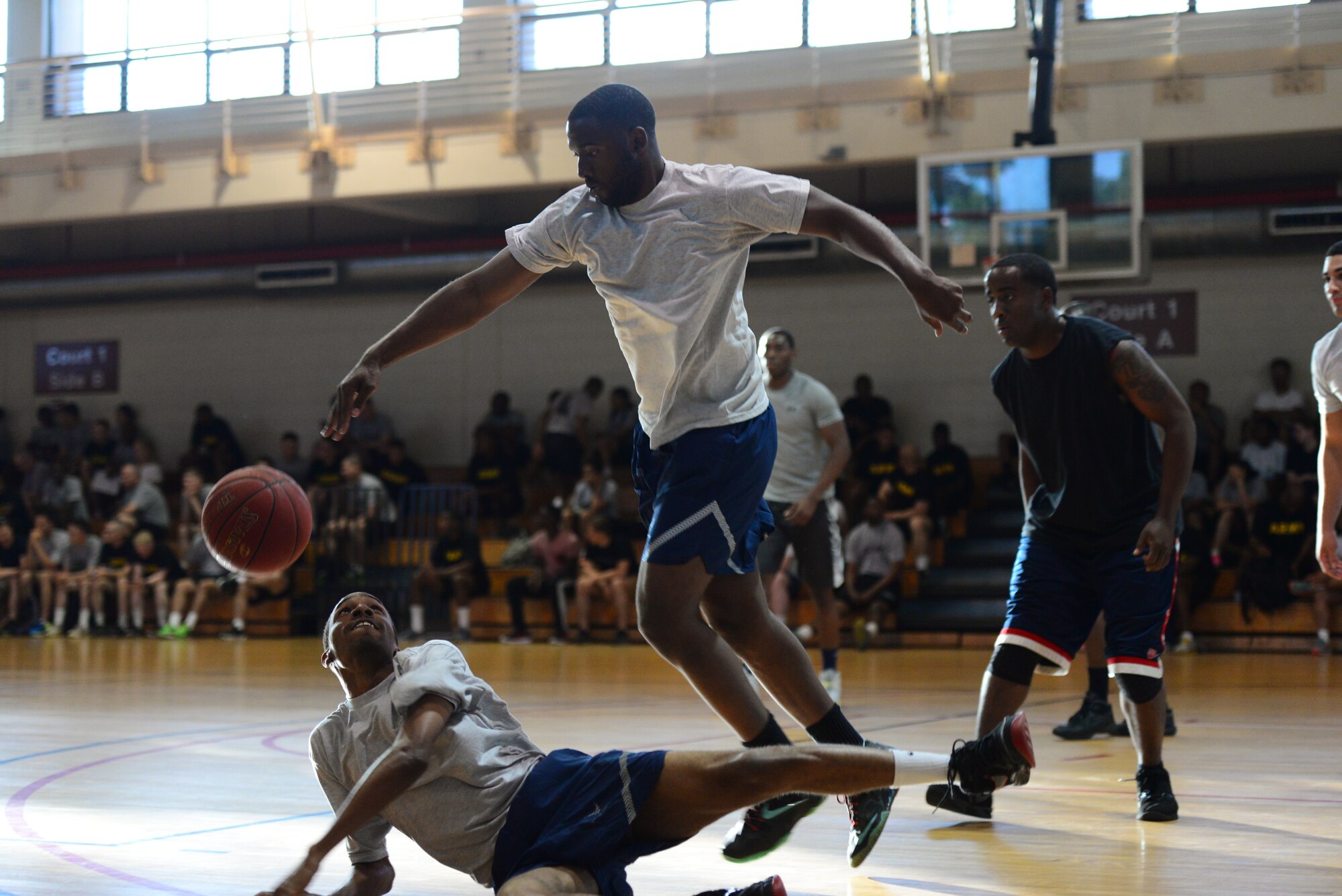 Osan’s Airmen leave it all on the court as they battle it out during the 3-on-3 basketball challenge at Osan Air Base, Republic of Korea, Sept. 29, 2015. The challenge was just one of the events that took place during the second annual Osan Cup.
(U.S. Air Force photo/Staff Sgt. Amber Grimm)
