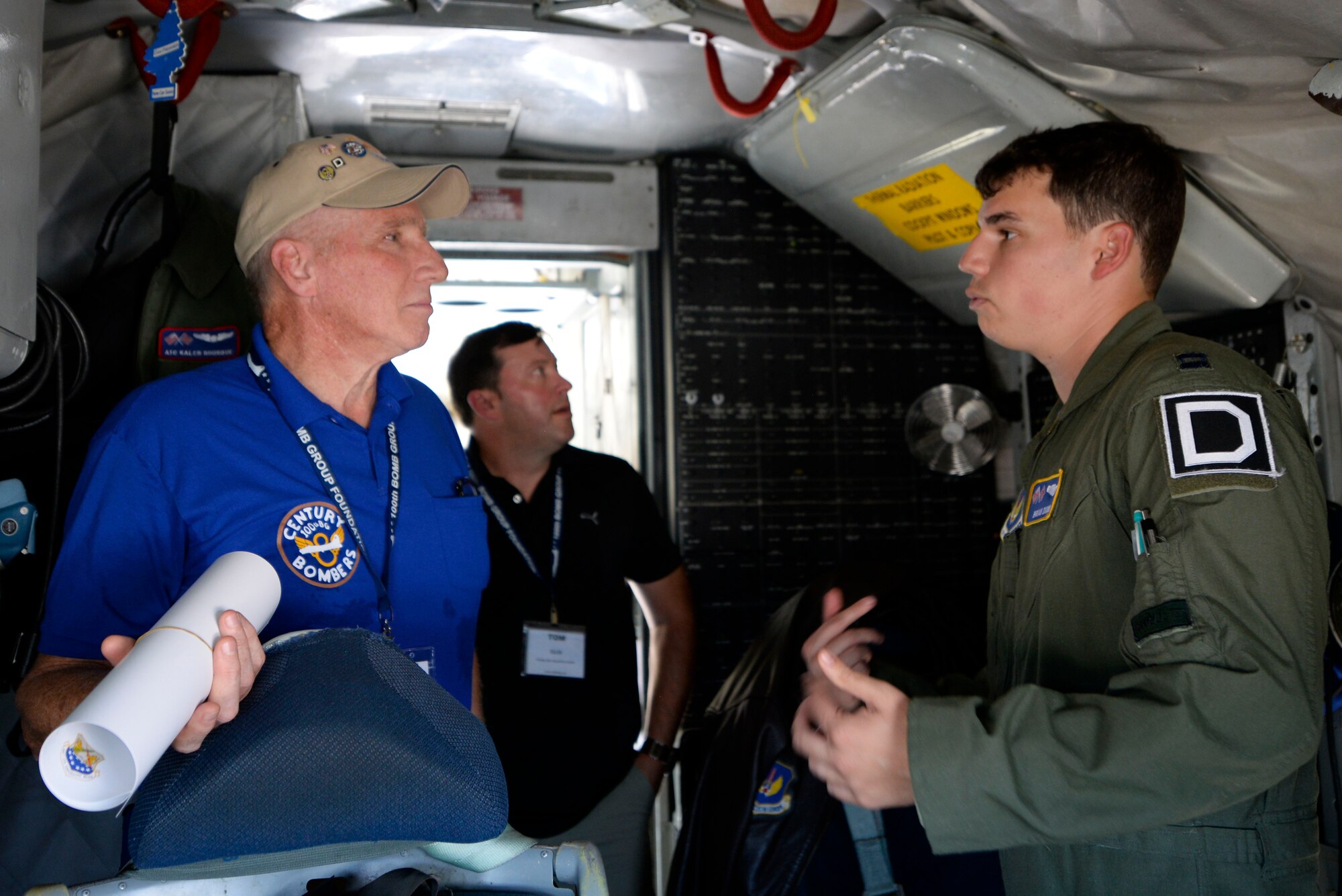 David Engel, left, son of World War ll veteran Russ Engel, speaks with U.S. Air Force Capt. Brian Dunn, 351st Air Refueling Squadron instructor pilot, while touring a static display Sept. 24, 2015, at Louis Armstrong New Orleans International Airport in New Orleans, La. The static display was just one of the visits planned for the 100th Bomb Group Foundation reunion which has been held for more than 40 years. (U.S. Air Force photo by Senior Airman Victoria H. Taylor/Released)