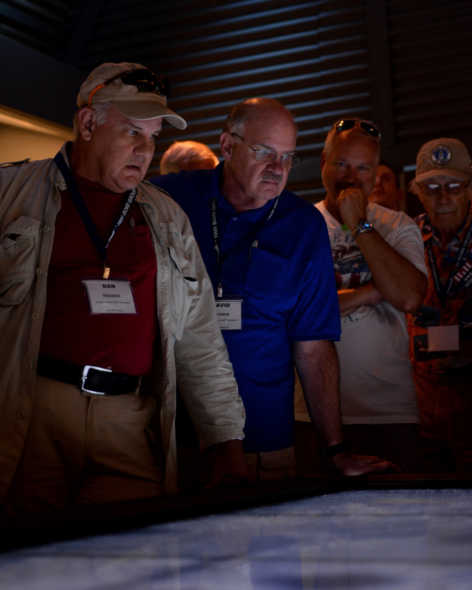Guests from the 100th Bomb Group Foundation reunion watch a visual presentation at the National World War ll museum Sept. 25, 2015, in New Orleans, La. The 100th Bomb Group Foundation is dedicated to the preservation and dissemination of first-hand historical accounts of the men, missions and machines that fought in the skies over Europe during World War ll. (U.S. Air Force photo by Senior Airman Victoria H. Taylor/Released)