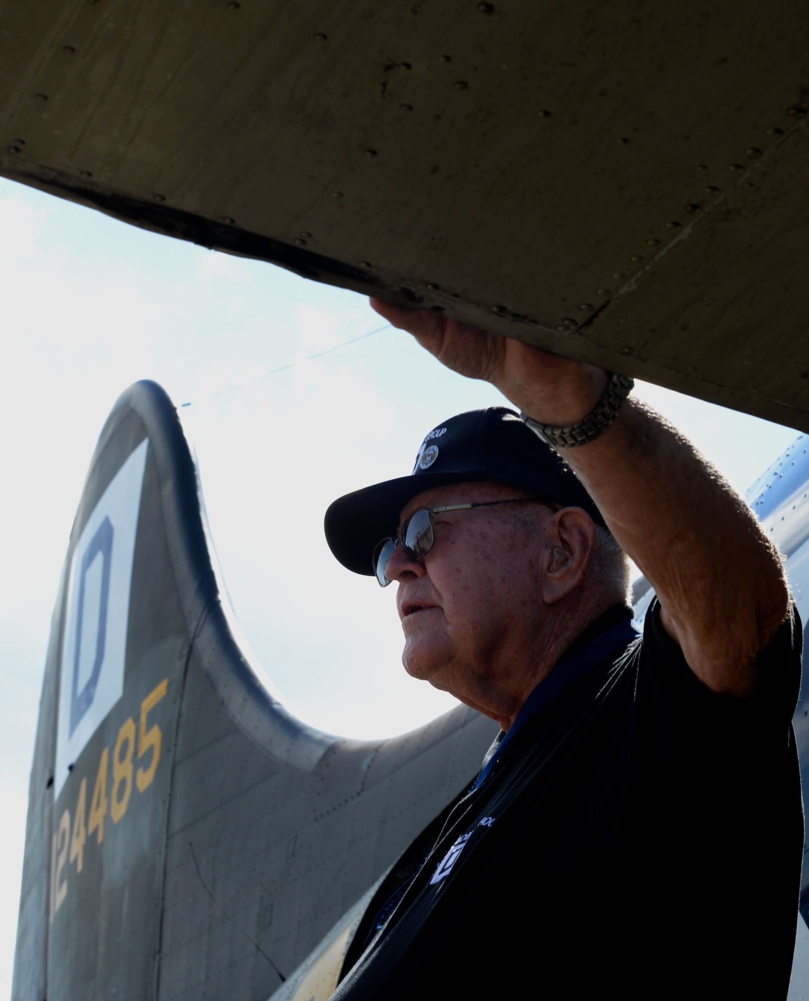 World War ll veteran Dewey Christopher rests on the wing of the B-17 Flying Fortress Sept. 24, 2015, at Louis Armstrong New Orleans International Airport in New Orleans, La. Christopher was a crew chief who worked on the aircraft while stationed at Thorpe Abbots during World War ll. (U.S. Air Force photo by Senior Airman Victoria H. Taylor/Released))