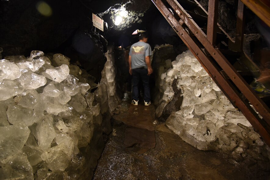 A man walks through a tunnel flanked by ice walls at the Narusawa Hyouketsu Ice Cave in Yamanashi, Japan, Sept. 5, 2015. The Narusawa Hyouketsu Ice Cave stays an average temperature of 37 degrees Fahrenheit year-round. (U.S. Air Force photo by Senior Airman Michael Washburn/Released)