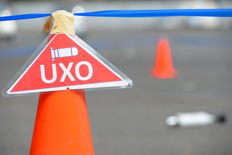 A simulated unexploded ordnance is cordoned during a Chemical, Biological, Radiological, Nuclear and Explosives defense survival skills refresher course at Yokota Air Base, Japan, Sept. 29, 2015. Learning to carefully and properly identify and respond to UXOs is an important part of keeping Airmen prepared for contingency situations. (U.S. Air Force Photo by Airman 1st Class Elizabeth Baker/Released)