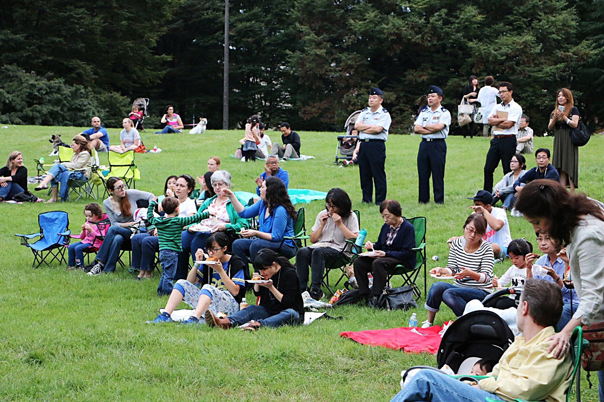Community members, Japanese citizens, and members of the Japan Air-Self Defense Force listen to live performances during the Sexual Assault Awareness Summer Series Concerts Sept. 26, 2015, at Yokota Air Base, Japan. The series concerts were a collection of concerts held throughout the summer to increase awareness regarding sexual assault and promote an assault-free community. (Courtesy photo)